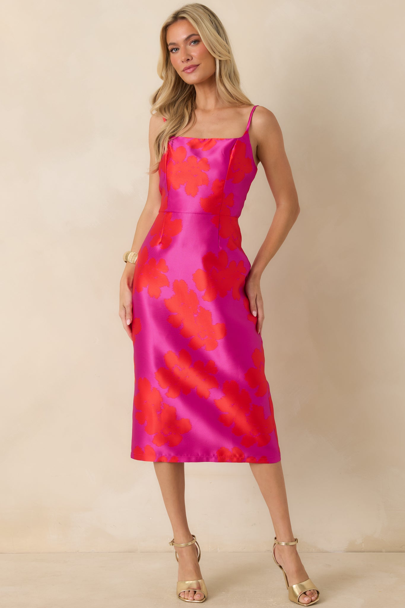 Fuchsia and red floral jacquard midi dress featuring a square neckline, adjustable spaghetti straps, and a fitted silhouette.