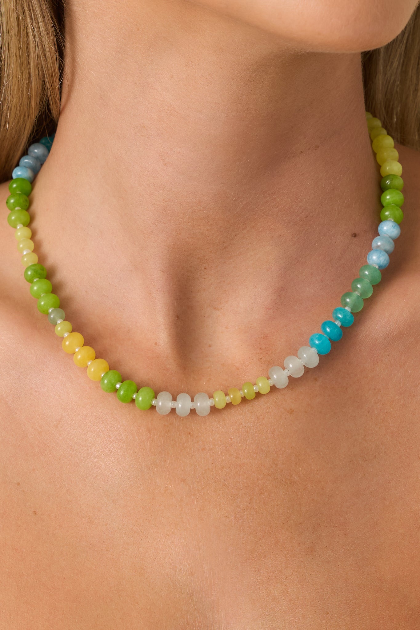 Vibrant glass bead necklace showcasing a bright coastal-inspired color palette and delicate gold-tone clasp detail.