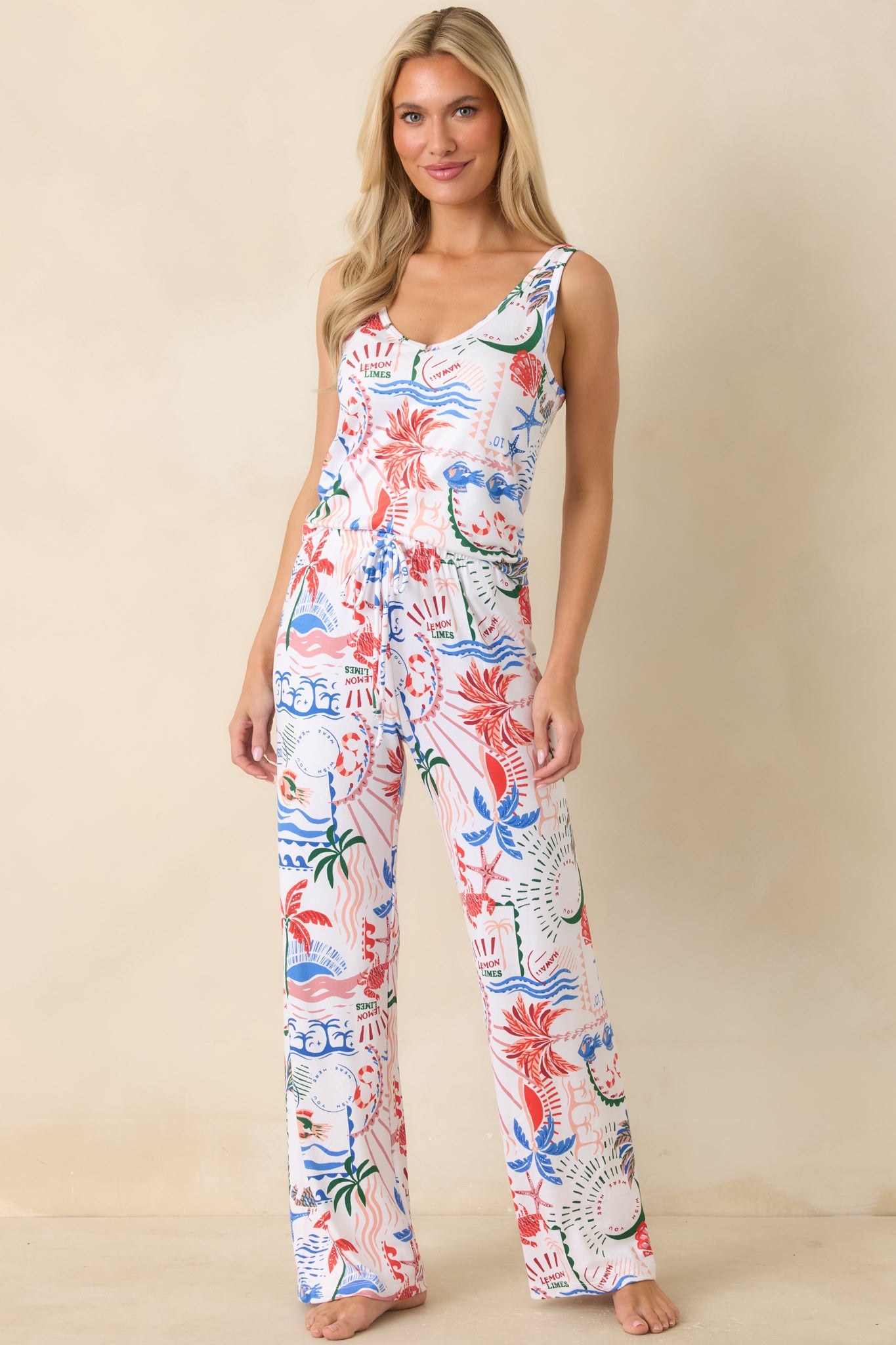 Front full view highlighting the double V-neckline and sleeveless cut with soft drape through the body for a comfortable fit.