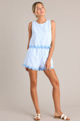 Full body view of this light blue stripe tank that features a crew neckline, a wide sleeve, a discrete zipper down the back, and a ricrac hemline.