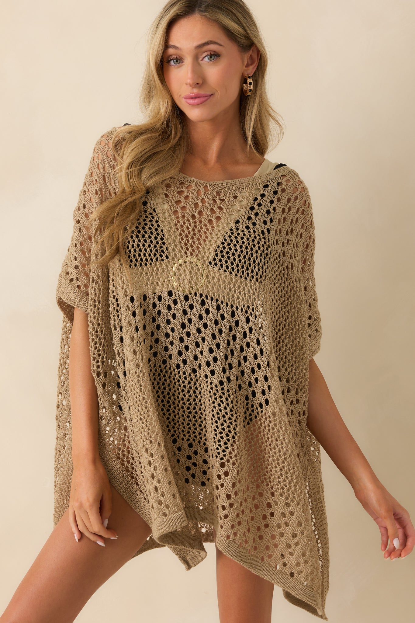 A cropped front view focusing on the deep v-neckline and the textured chunky knit pattern.