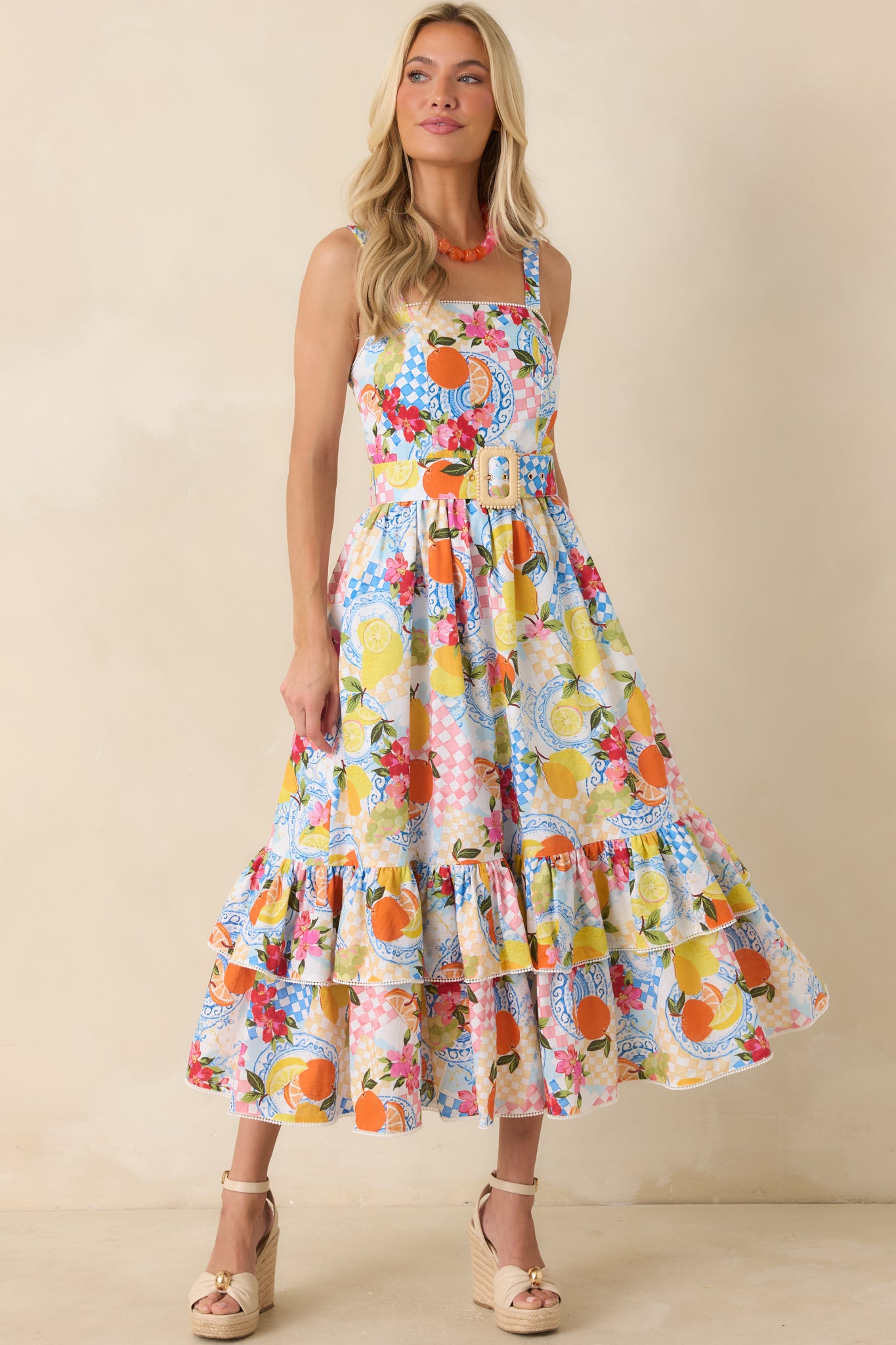Citrus print midi dress with a tiered skirt that adds soft volume and movement in a lightweight, breezy silhouette.