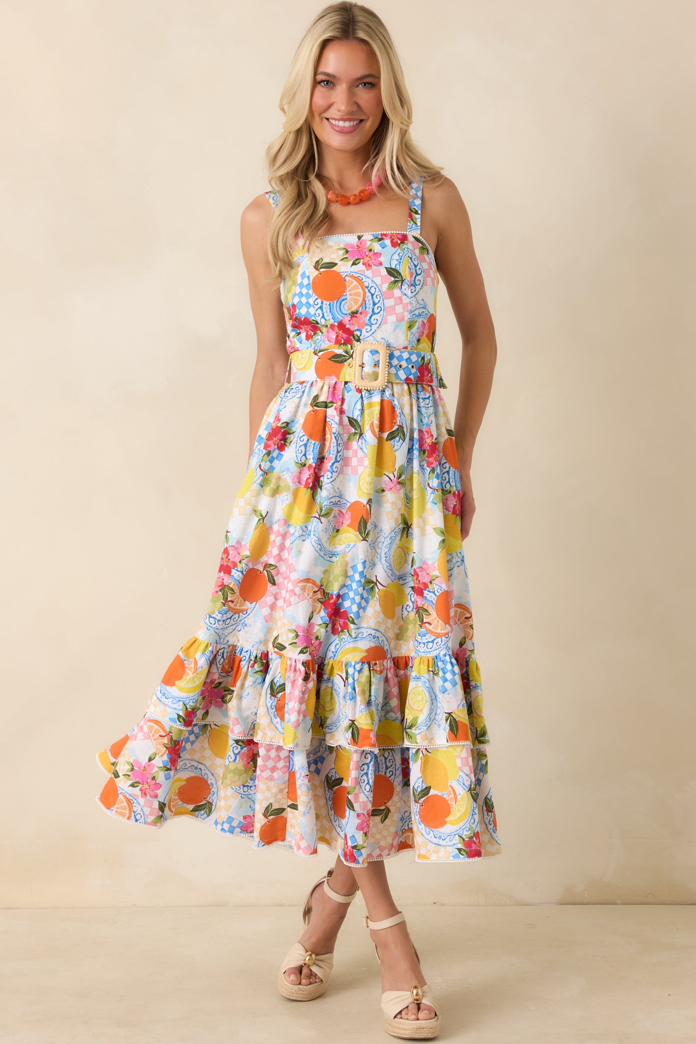 Midi dress highlighting side pockets integrated into the seam lines for a functional yet seamless look within the citrus pattern.