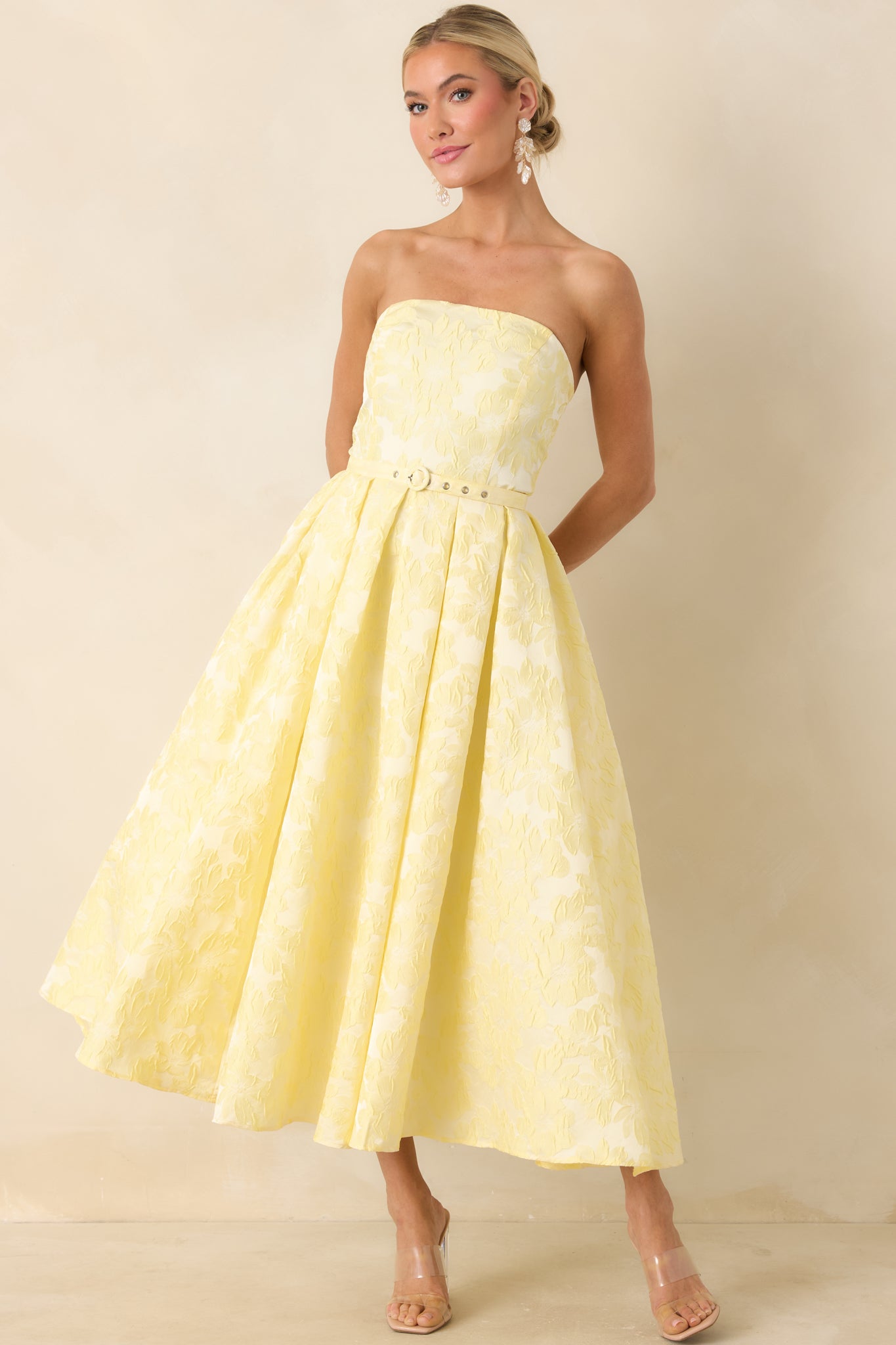 Structured strapless midi dress, with delicate buckle belt and voluminous skirt shape.