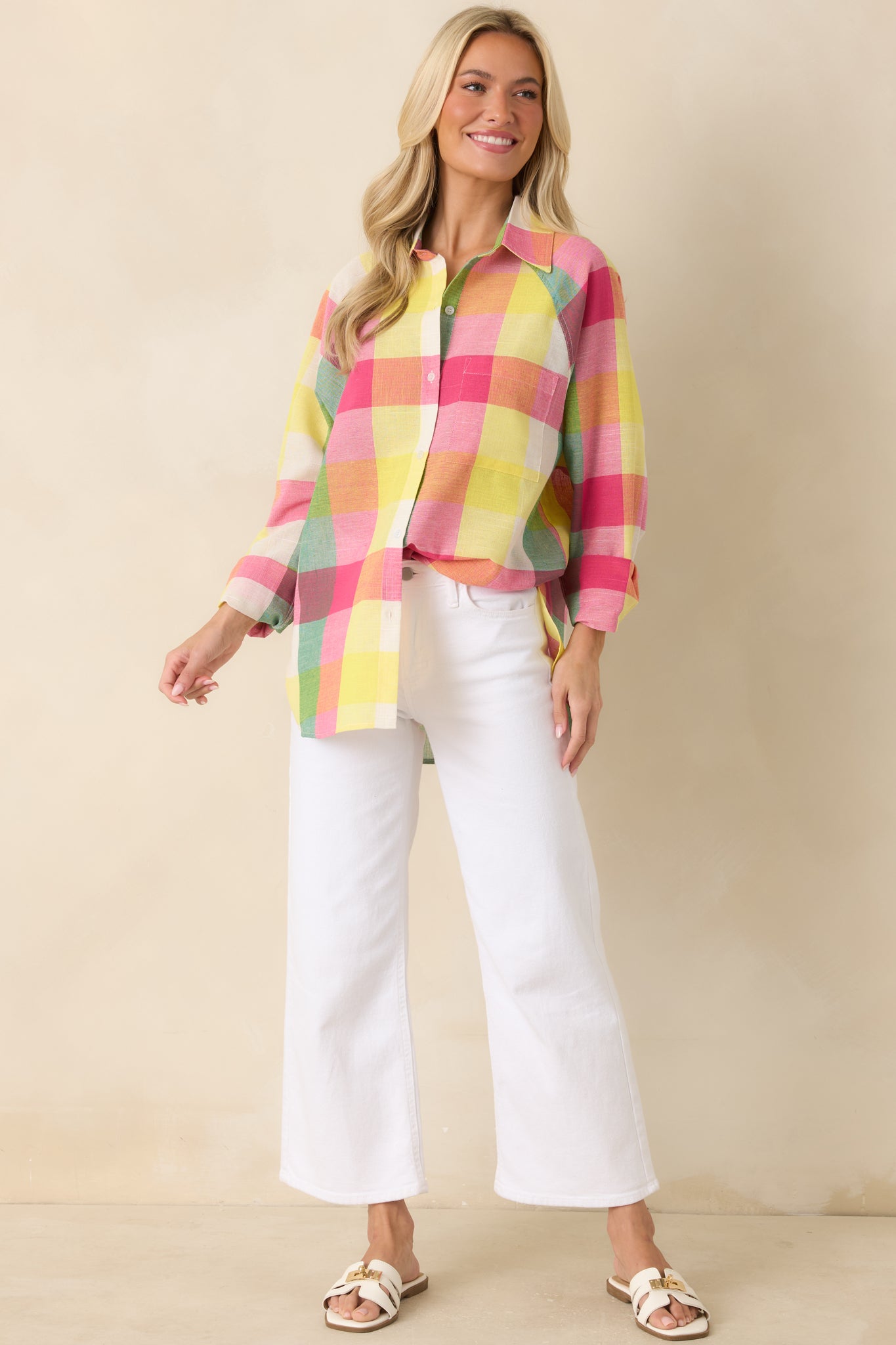 Pink multi plaid cotton shirt with a collared neckline, button-front closure, long sleeves, and a relaxed silhouette.