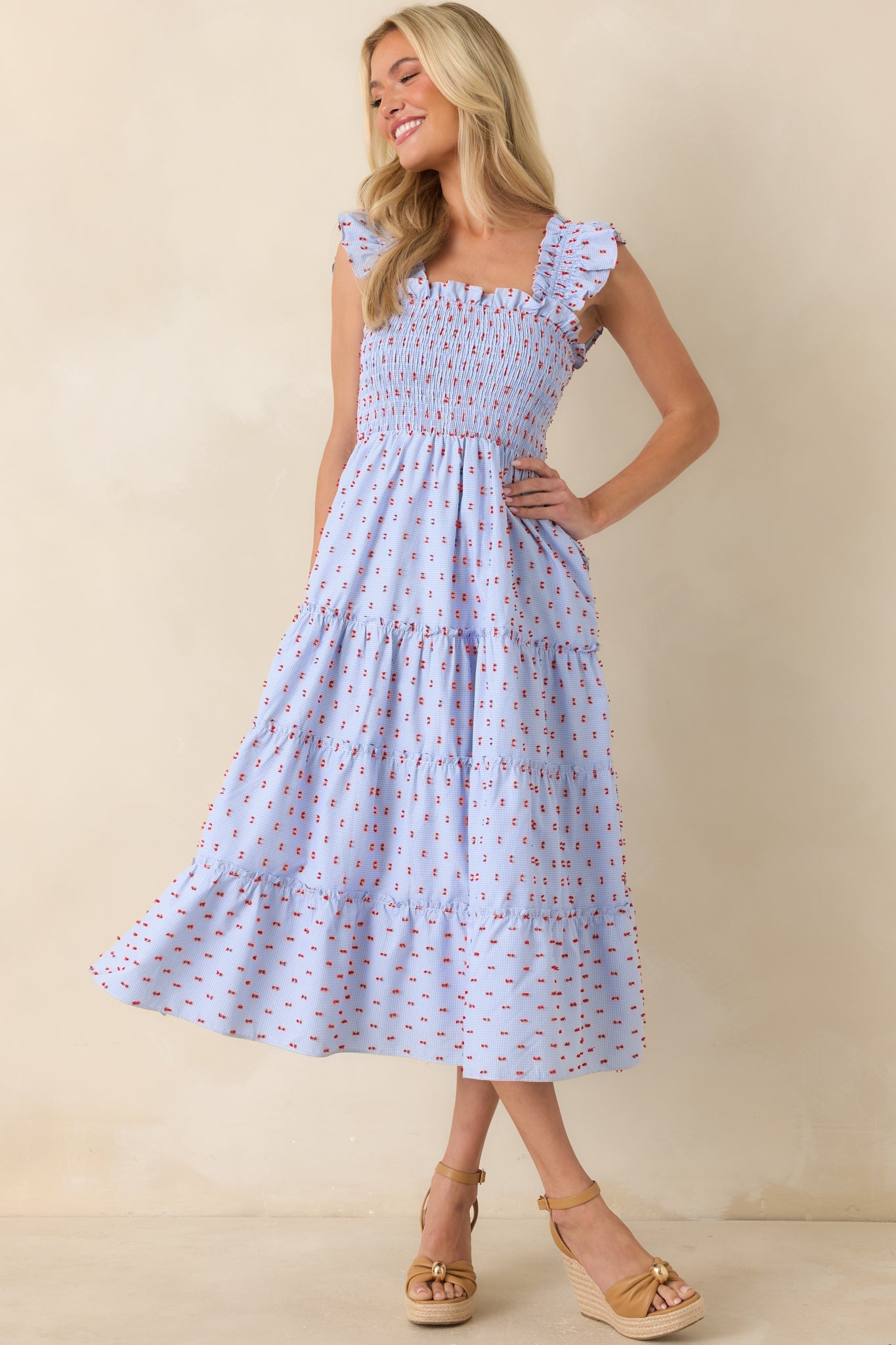 Relaxed-fit gingham midi dress with red tufted embroidery, side pockets, and a flattering square neckline.