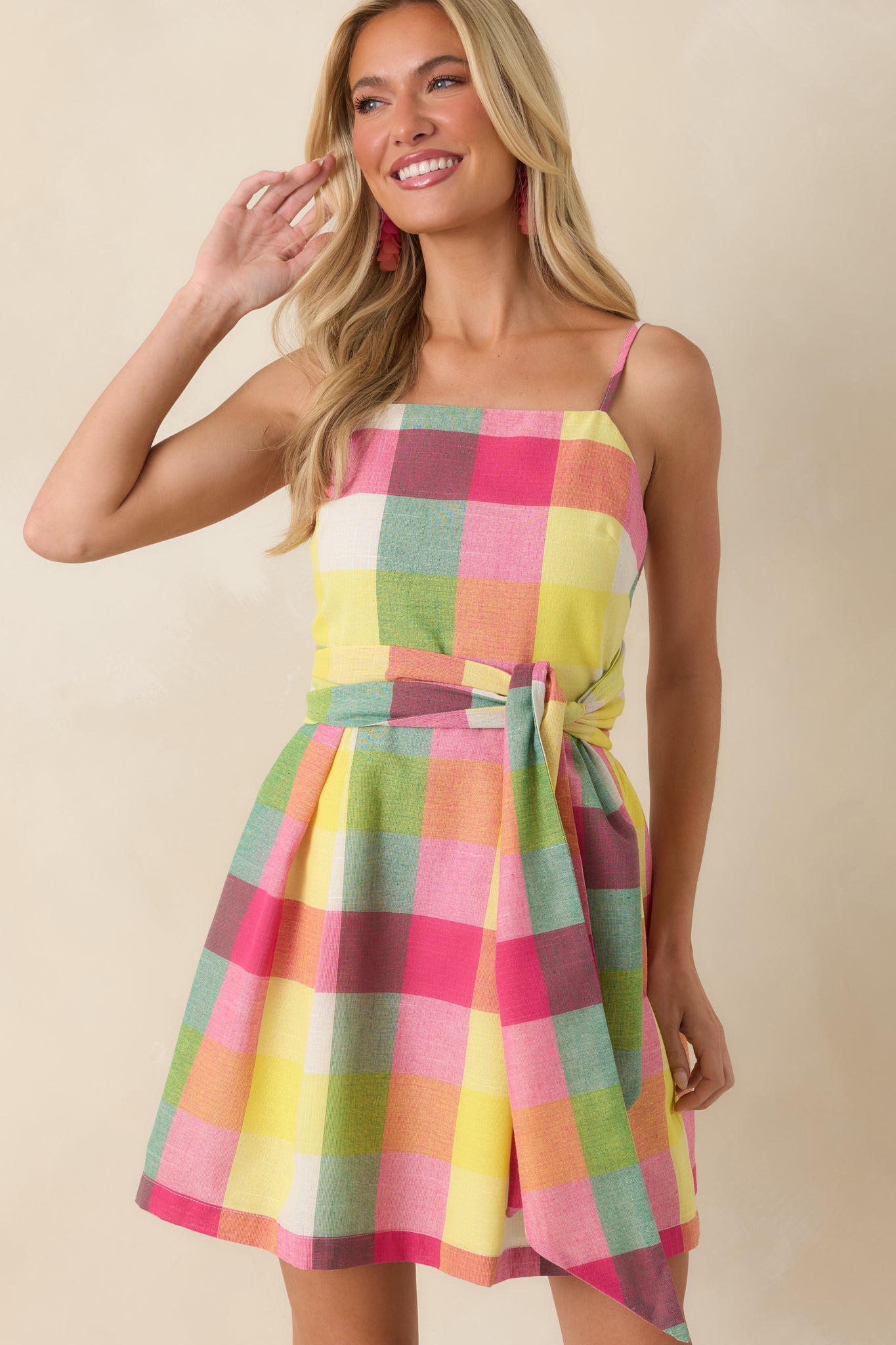 Multi plaid mini dress detail featuring the square neckline and structured bodice construction.