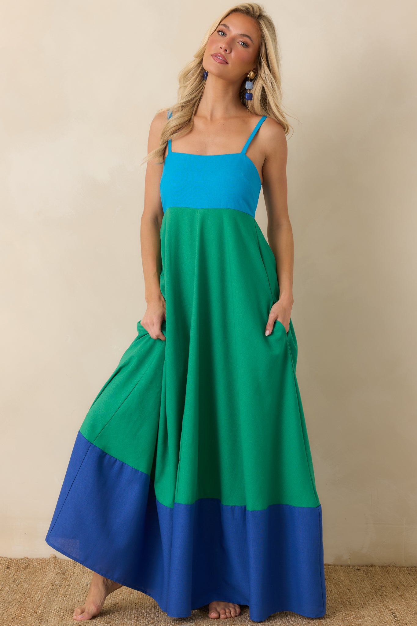 Maxi dress in green and blue tones with a comfortable stretch bodice, relaxed fit through the skirt, and coastal-inspired color blocking.