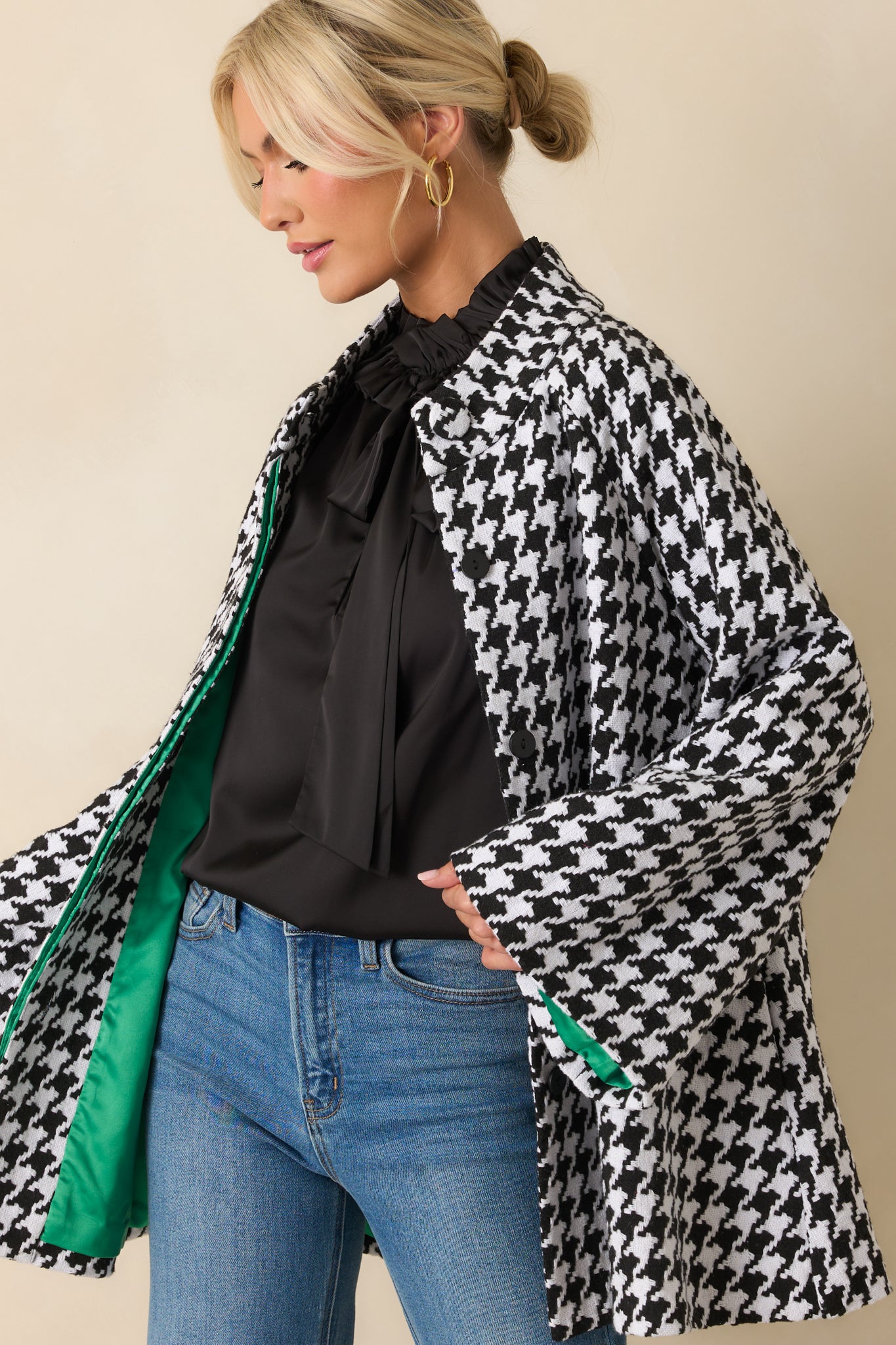 Woven houndstooth coat with a clean silhouette, functional buttons, and smooth lined interior.
