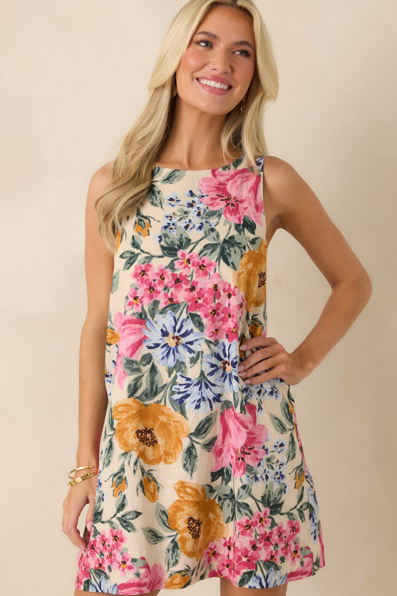 Closer look at the mini dress highlighting the vivid floral design and soft, breathable fabric construction.