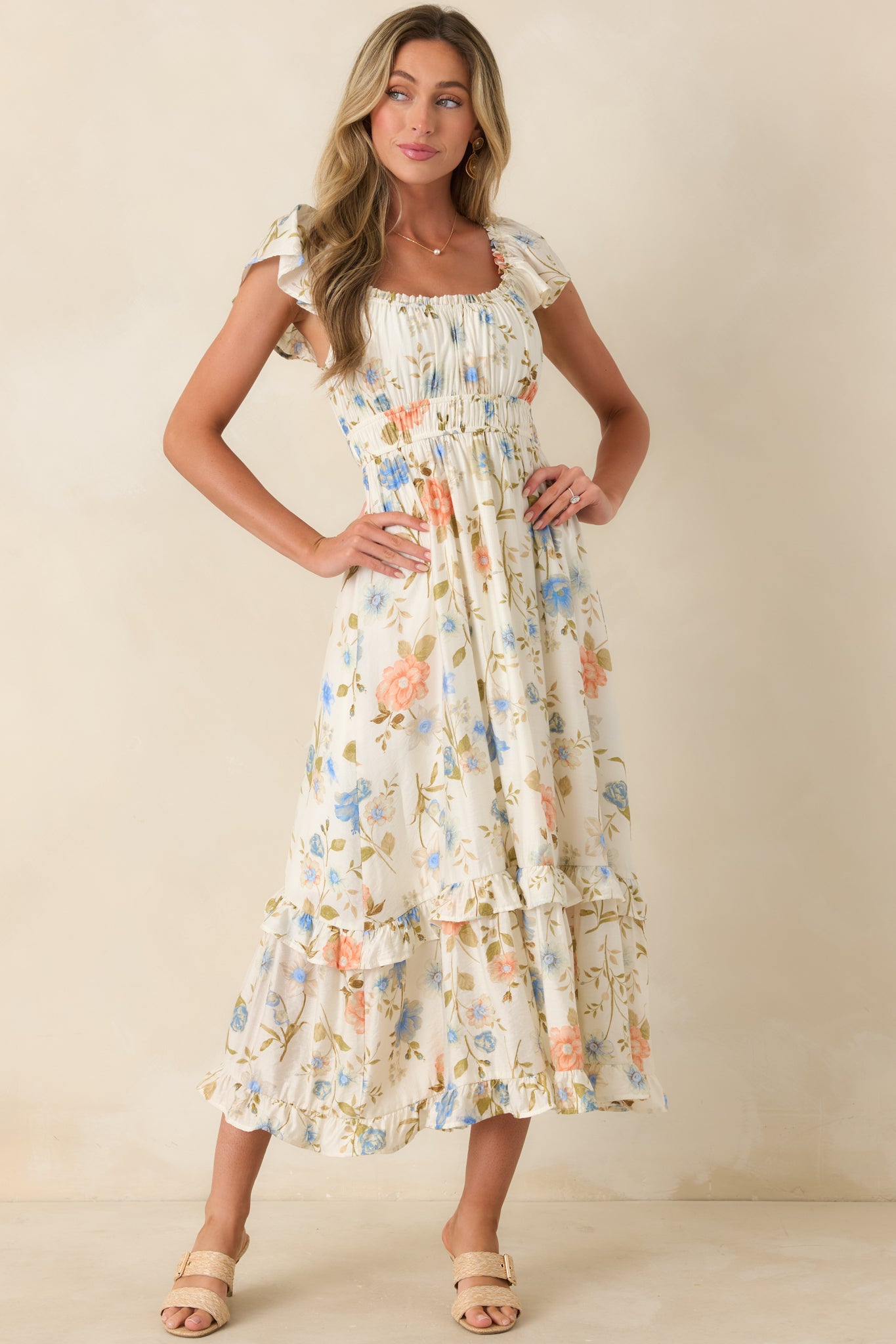 Ivory floral midi dress with elastic waist and airy, lightweight construction.