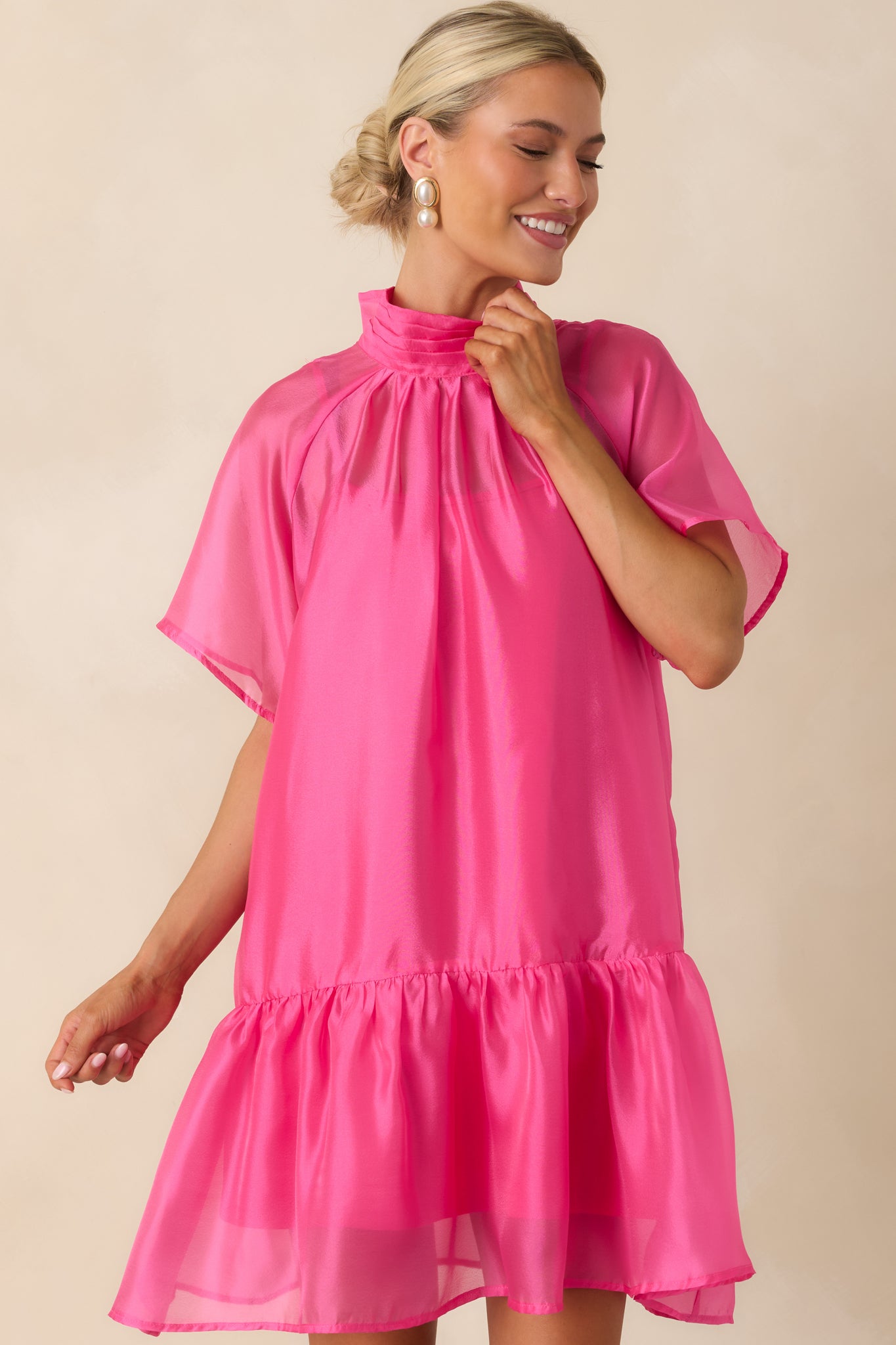 Pink organza mini dress featuring a soft shift shape and delicate airy fabric with subtle volume.