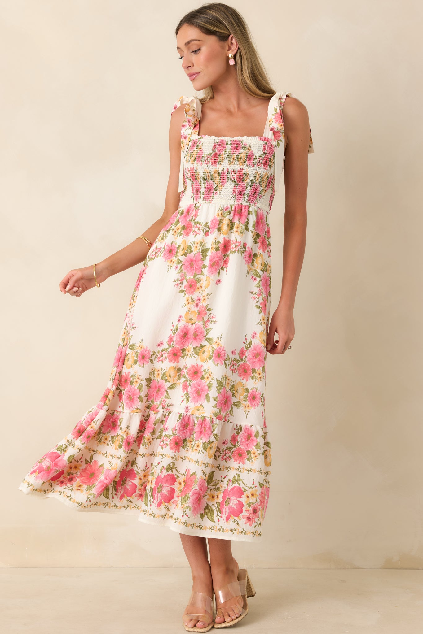 Floral midi dress with ruffle hem and lightweight, flowing skirt design.
