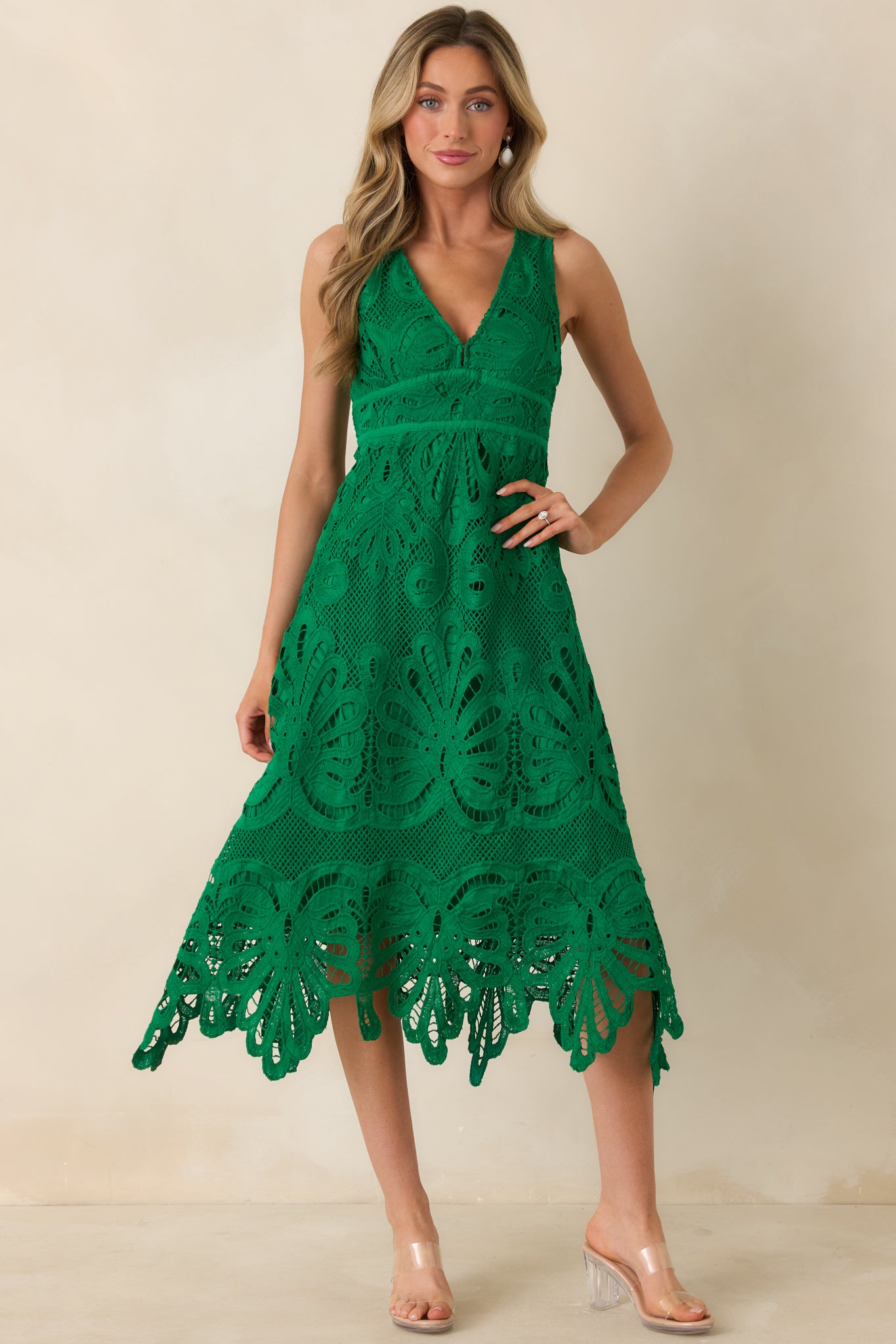 Green lace midi dress with a flattering V-neckline and fitted bodice.