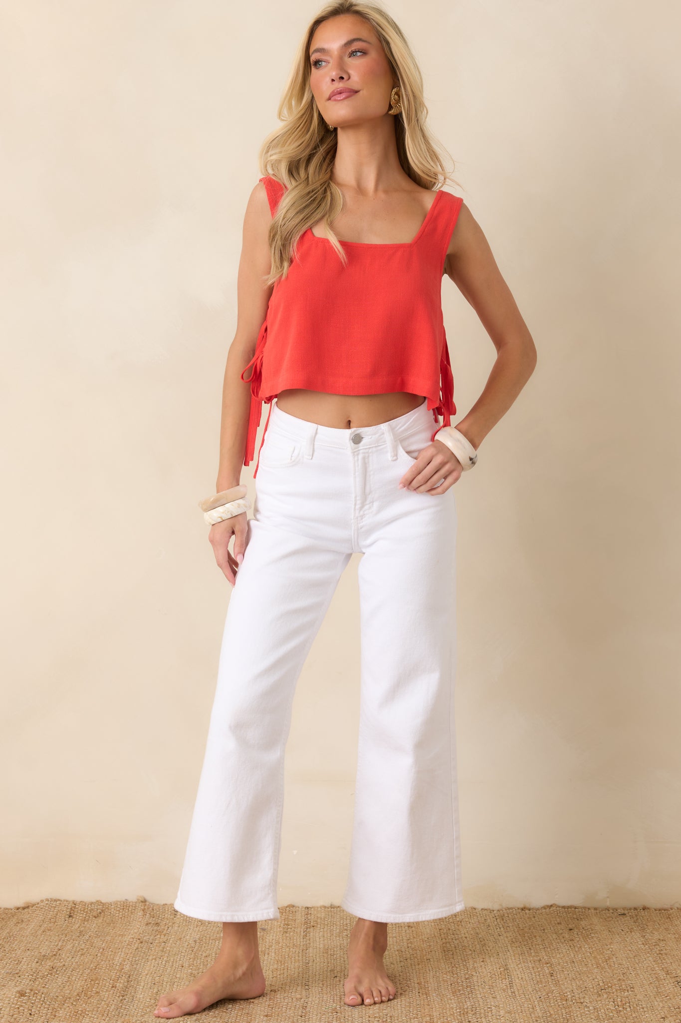 Cropped sangria top with adjustable double side ties, open side detailing, and a softly draped silhouette.