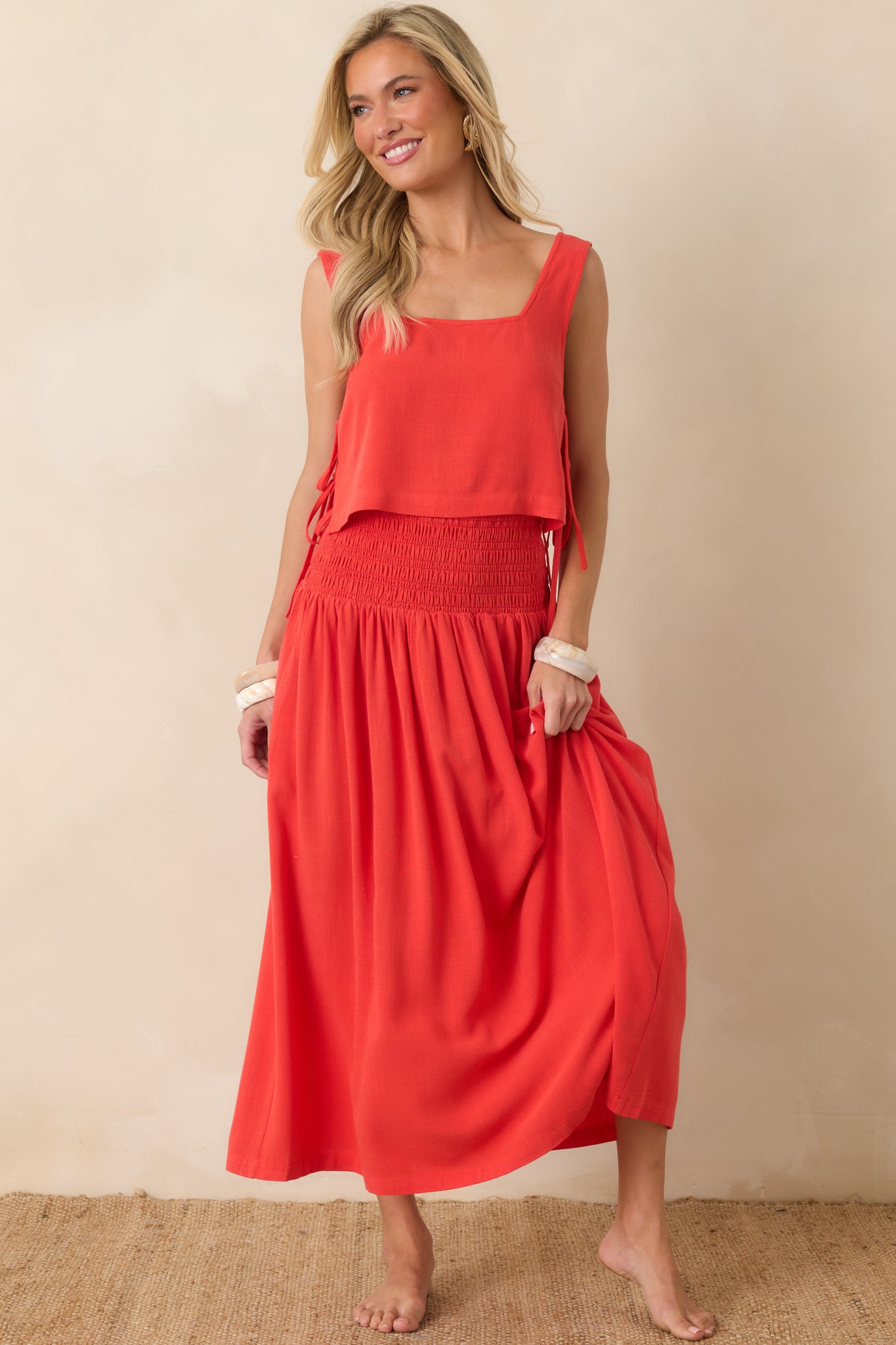 Sangria maxi dress featuring a smocked elastic bodice, gathered waist, and a flowing full-length skirt in a lightweight linen-blend fabric.