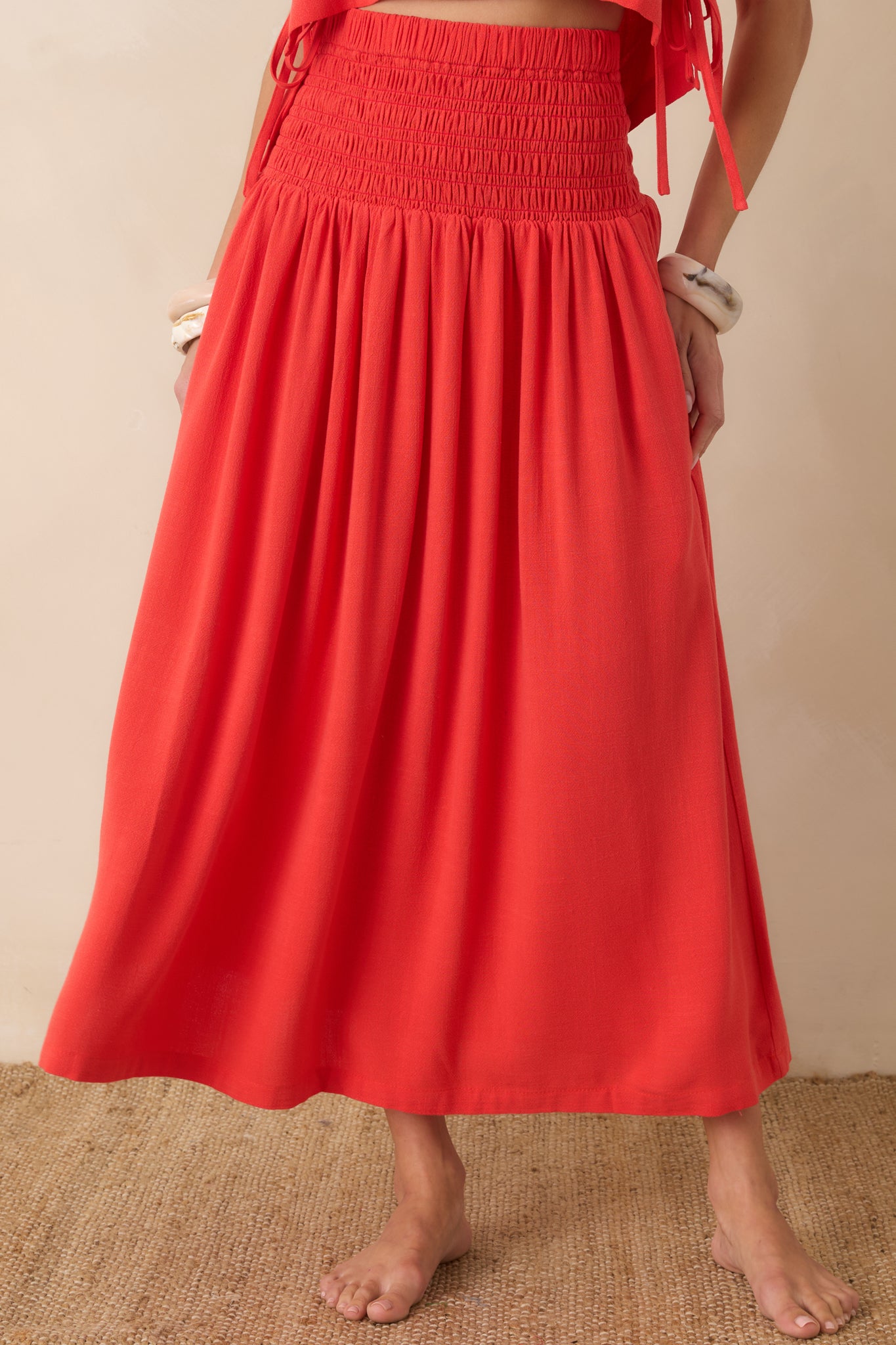 Detailed view of the smocked elastic bodice and gathered waistline creating a flattering, comfortable fit.