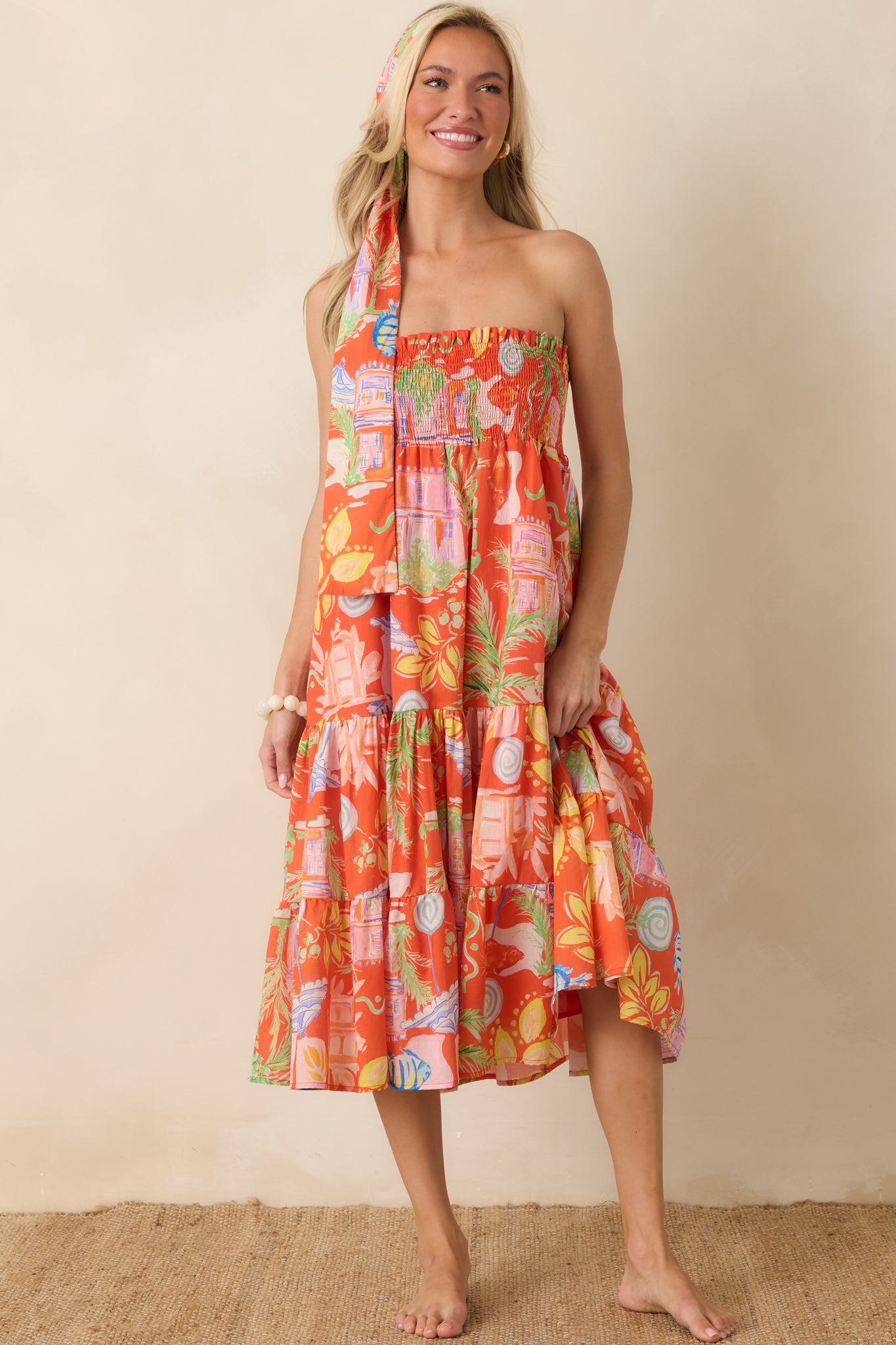 Versatile cotton convertible dress showcasing a strapless smocked top and flowing tiered skirt with airy movement.