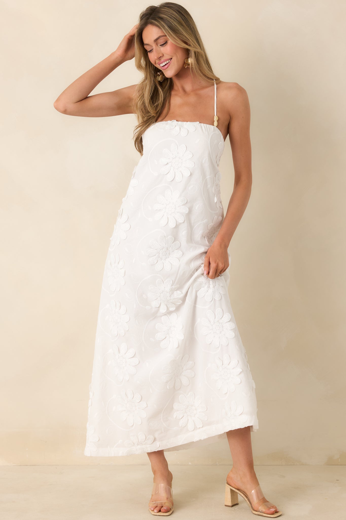 Angled front view highlighting breathable cotton material and relaxed silhouette with subtle floral accents.