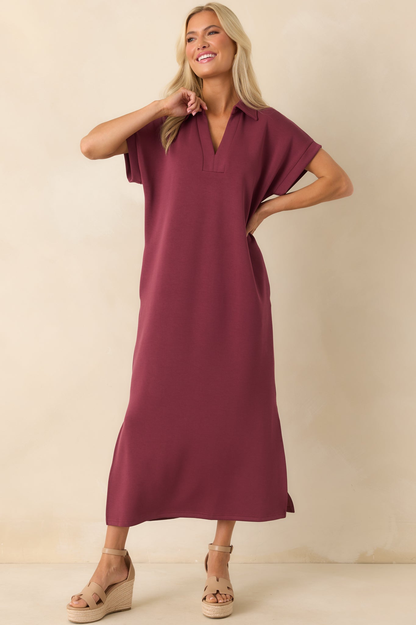 Full-length image of burgundy dress with collared neckline, short sleeves, and straight silhouette.