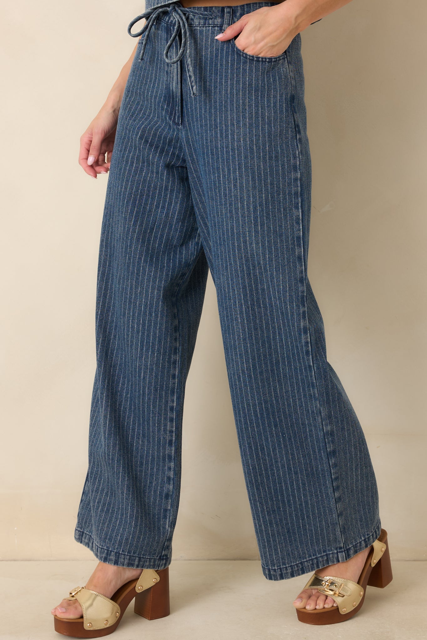Front detail framing of the elastic waistband and drawstring tie for an adjustable, comfortable fit.
