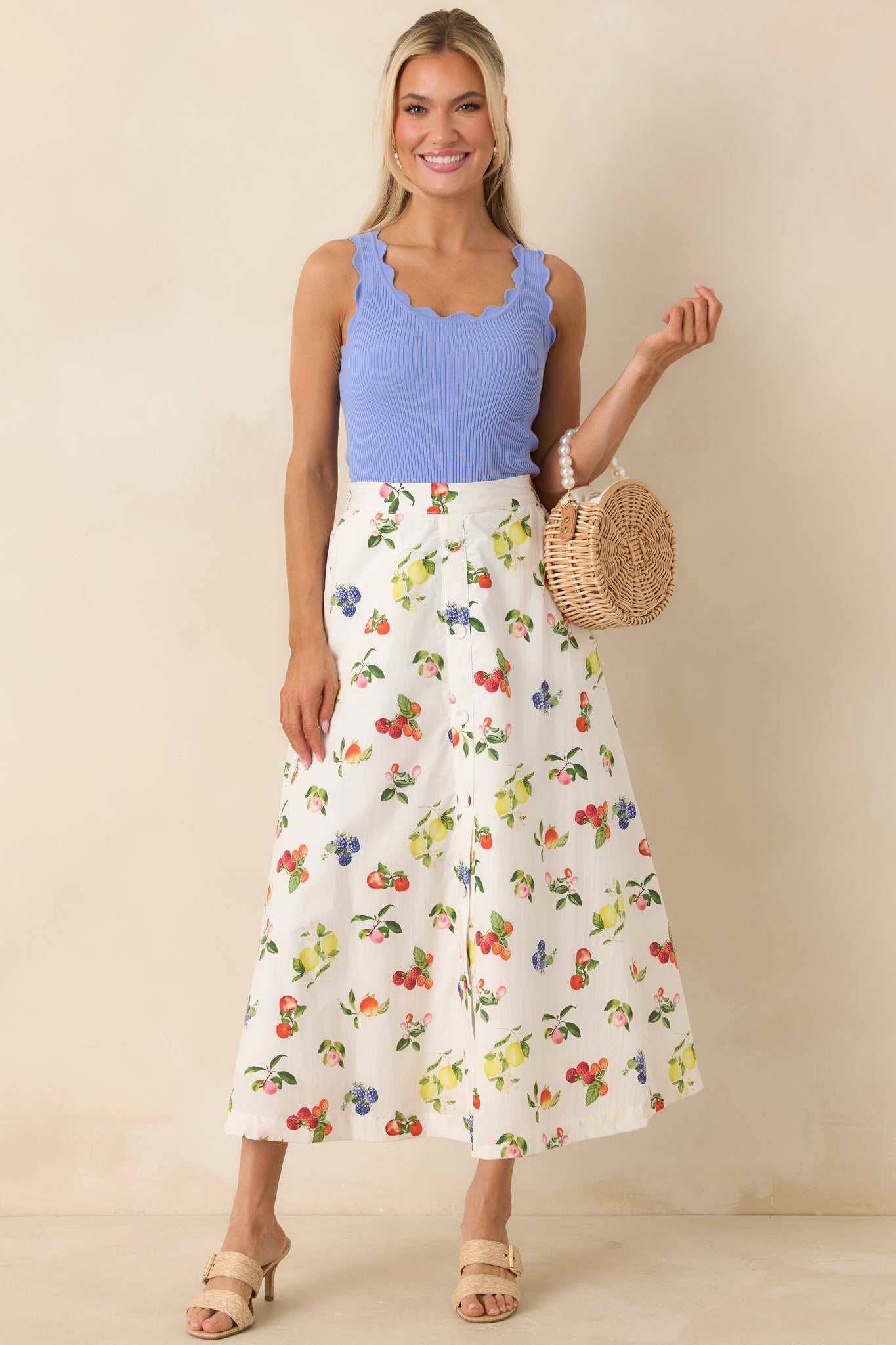 Straight-on front view emphasizing the soft drape and scalloped hem detailing.