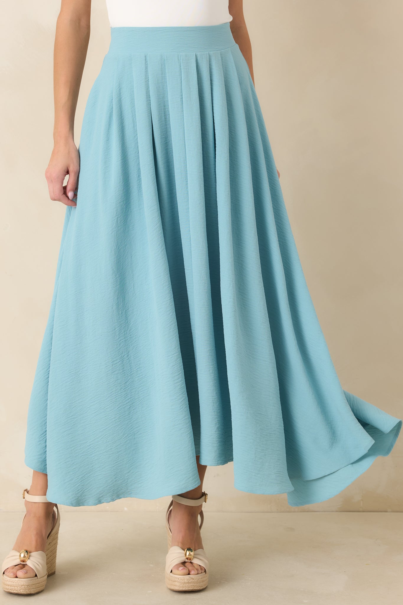 Front view of the turquoise maxi skirt highlighting the elastic waistband and fluid drape.