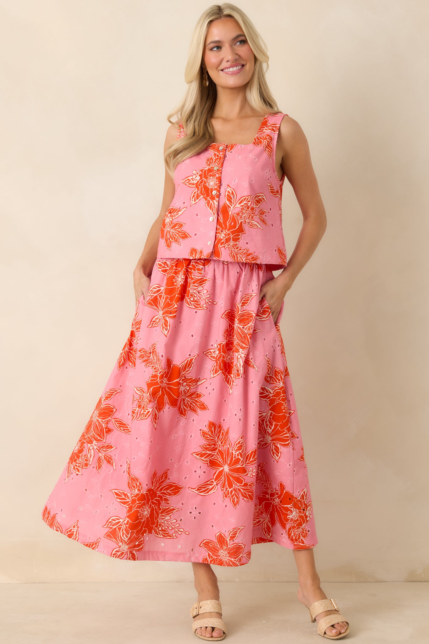 Cotton eyelet midi skirt with bold floral print, easy drape, and comfortable elastic waist.