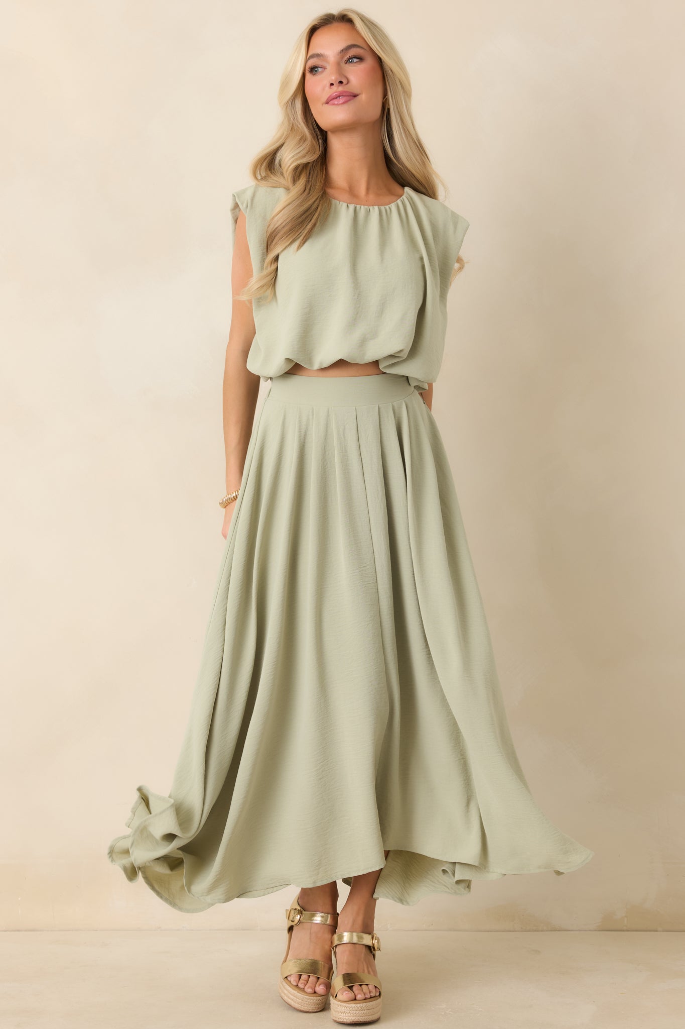 Sage green maxi skirt with elastic waistband and a flowing, relaxed silhouette.