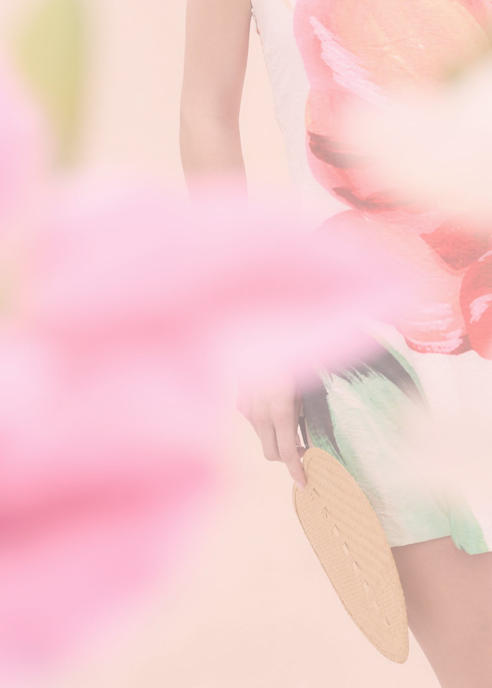 Close-up of a beige insole on a blurred background with soft pink and green colors.