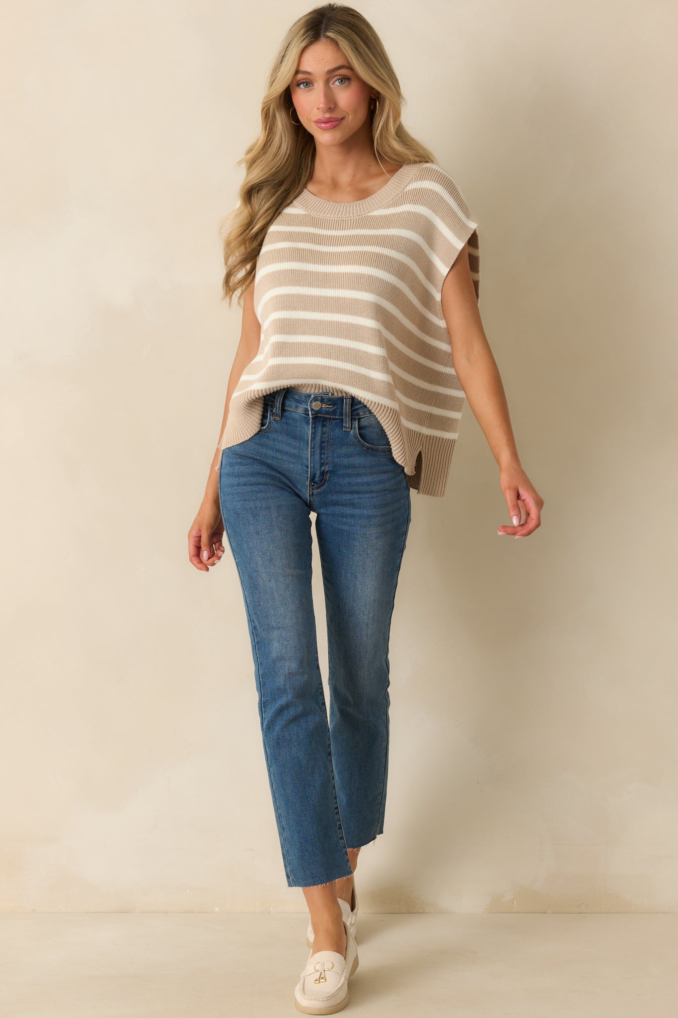 Front view of the vest emphasizing the relaxed silhouette and split ribbed hemline.