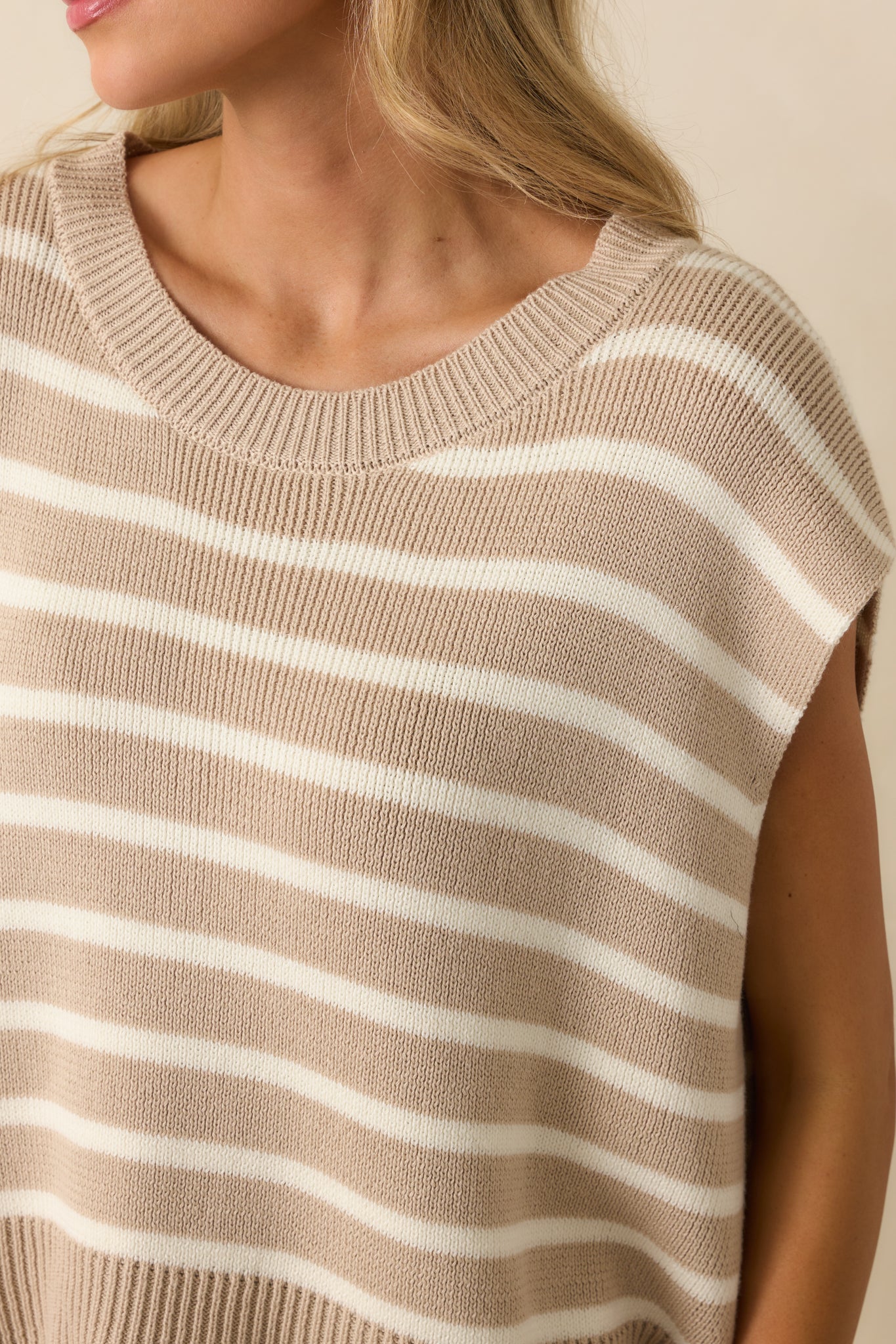 Detailed view of the ribbed crew neckline and horizontal stripe texture.