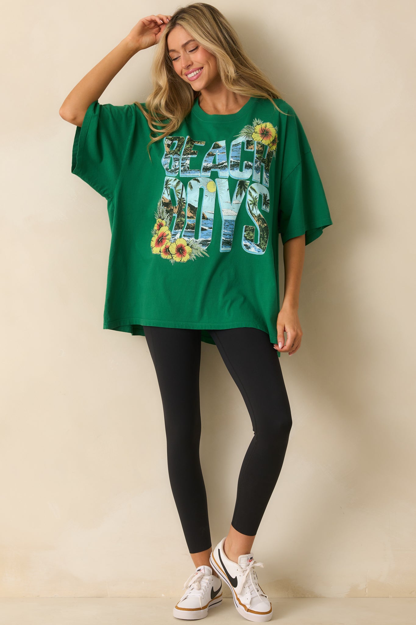 Full body view of the green tee showcasing the oversized fit and short sleeves.