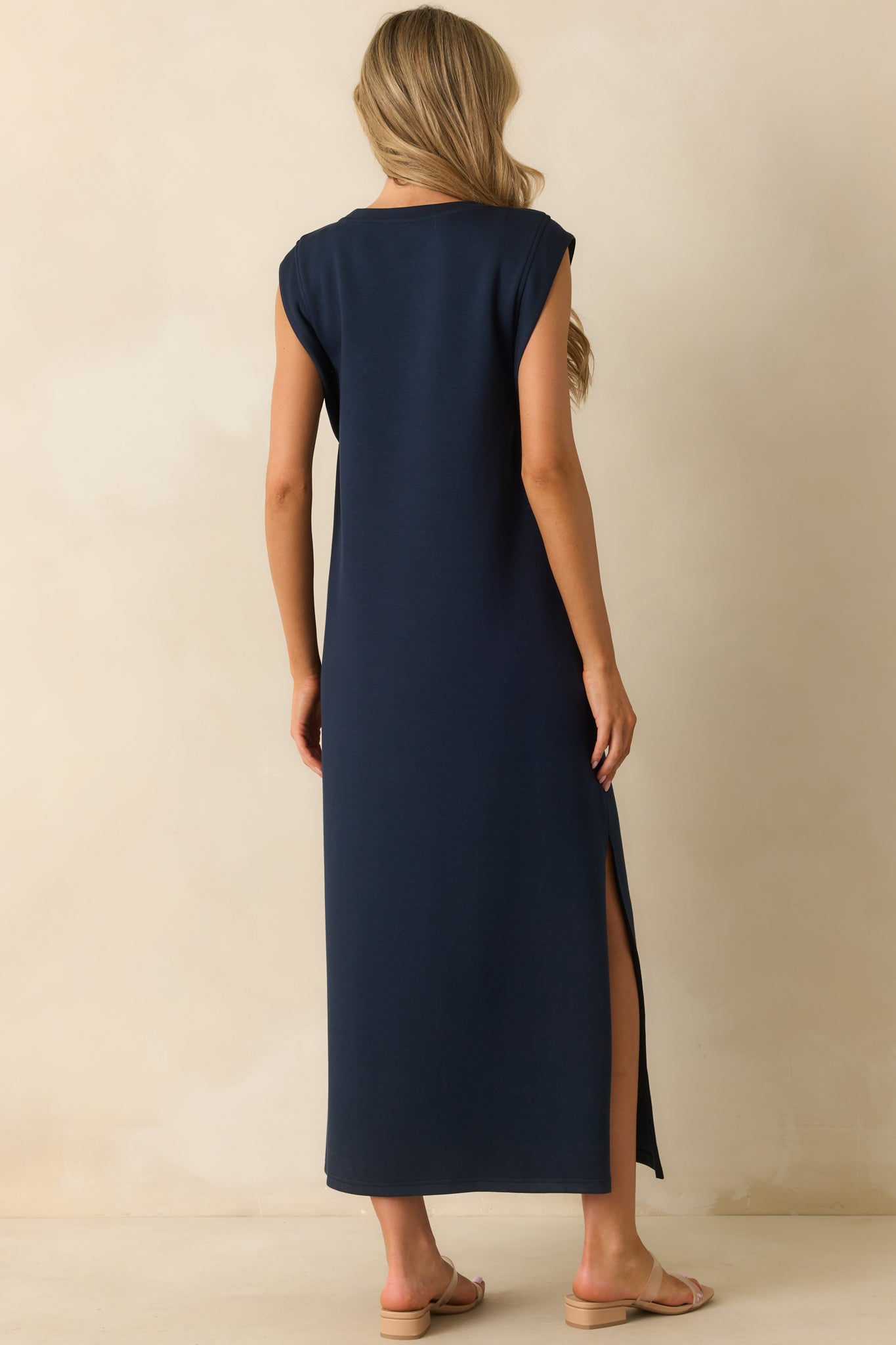 Rear view of the navy maxi dress showing the relaxed fit and flowing hemline.