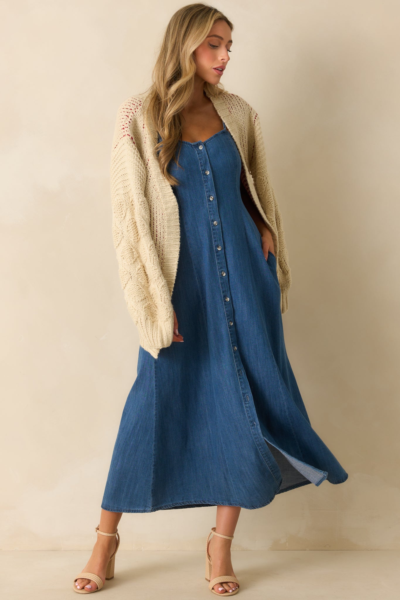 Full-length front photo emphasizing the side pockets and drape of the flowy skirt.