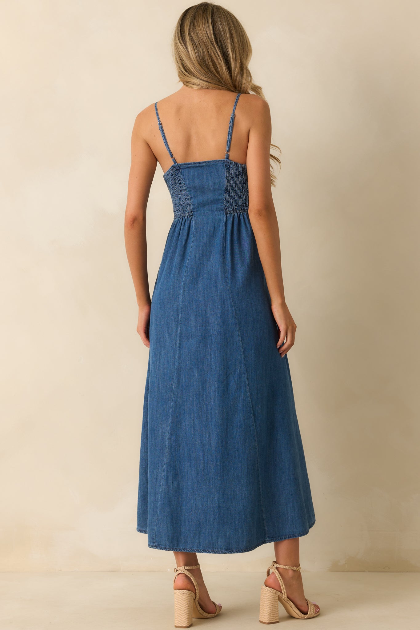 Back photo showing the spaghetti straps, fitted bodice, and flowy skirt silhouette.