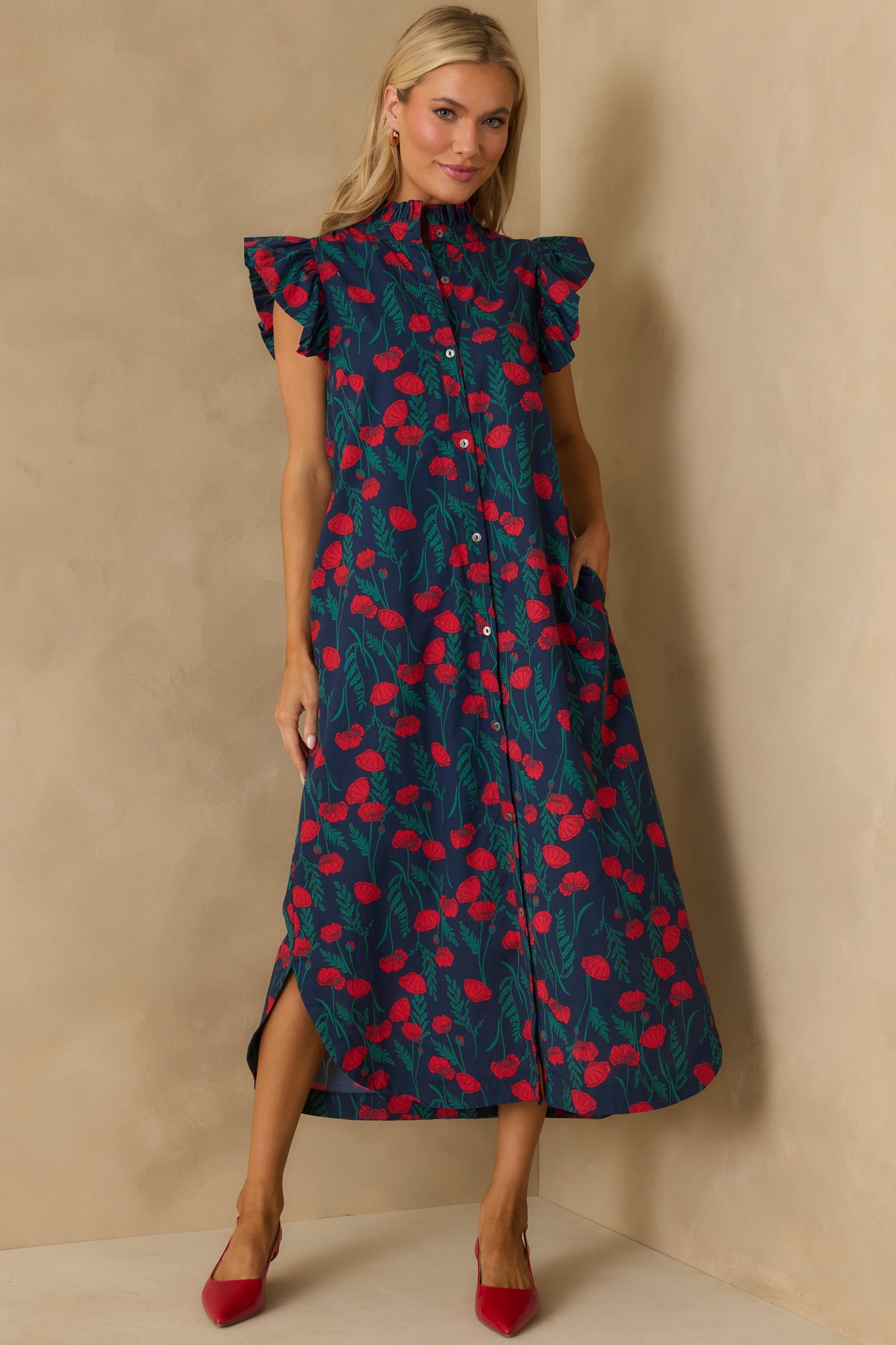 Flowing maxi dress featuring a ruffle neckline and functional button front.