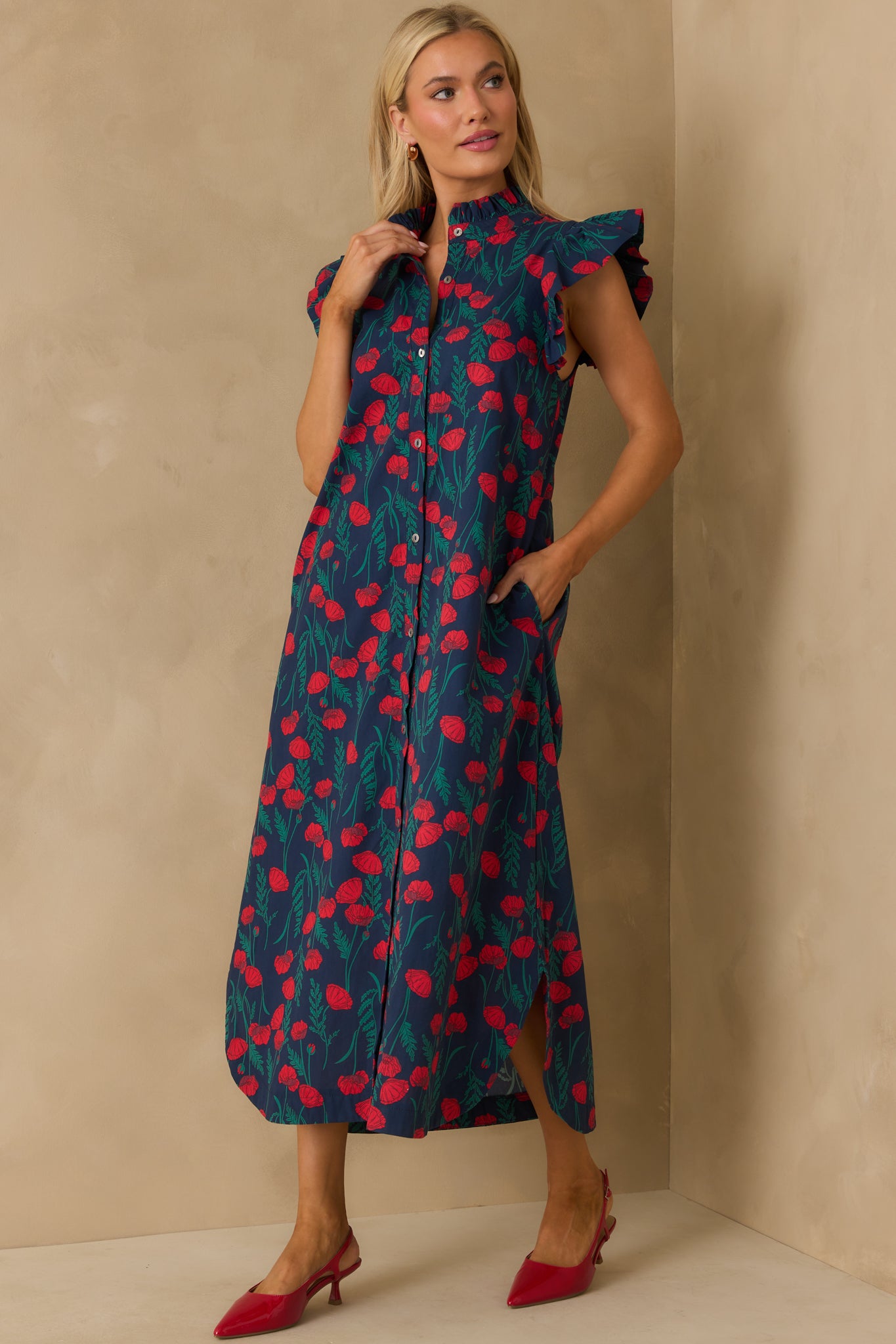 Relaxed-fit maxi with flutter sleeves and floral design over a navy base.