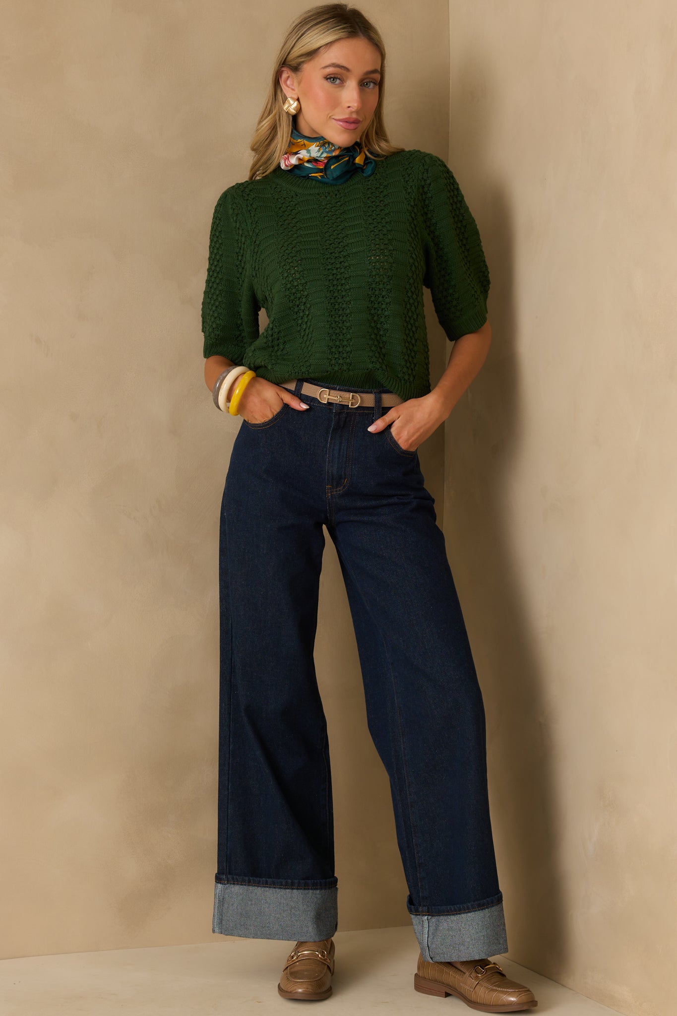 Full front view of the sweater emphasizing the vertical open-knit and ribbed texture patterns throughout the body.