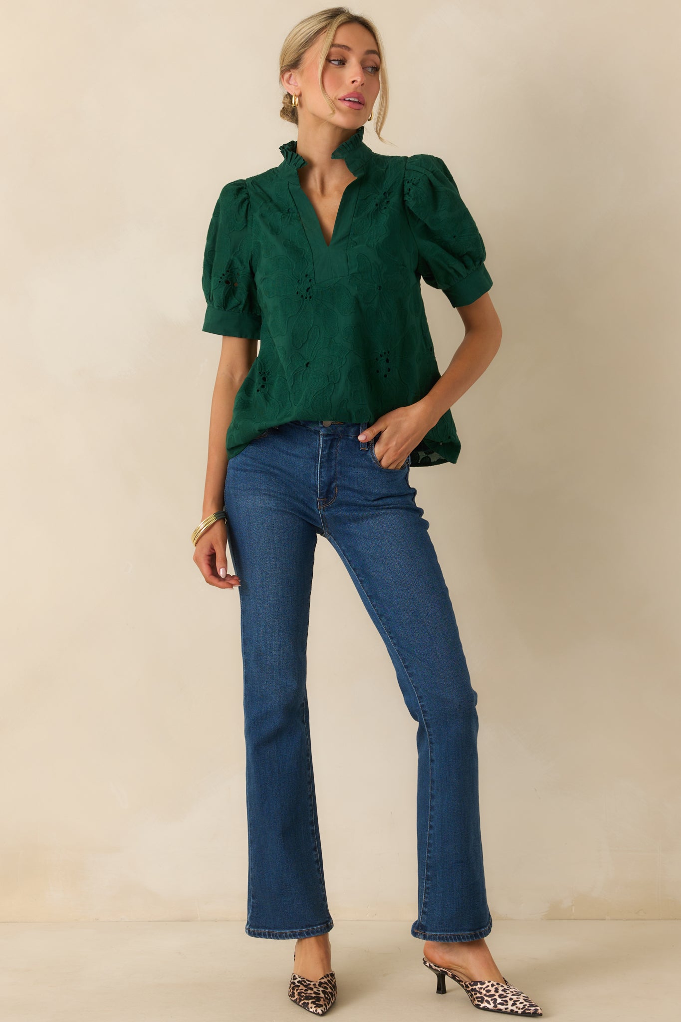 Hunter green blouse with embroidered floral eyelet design and split v-neckline with ruffle trim collar.