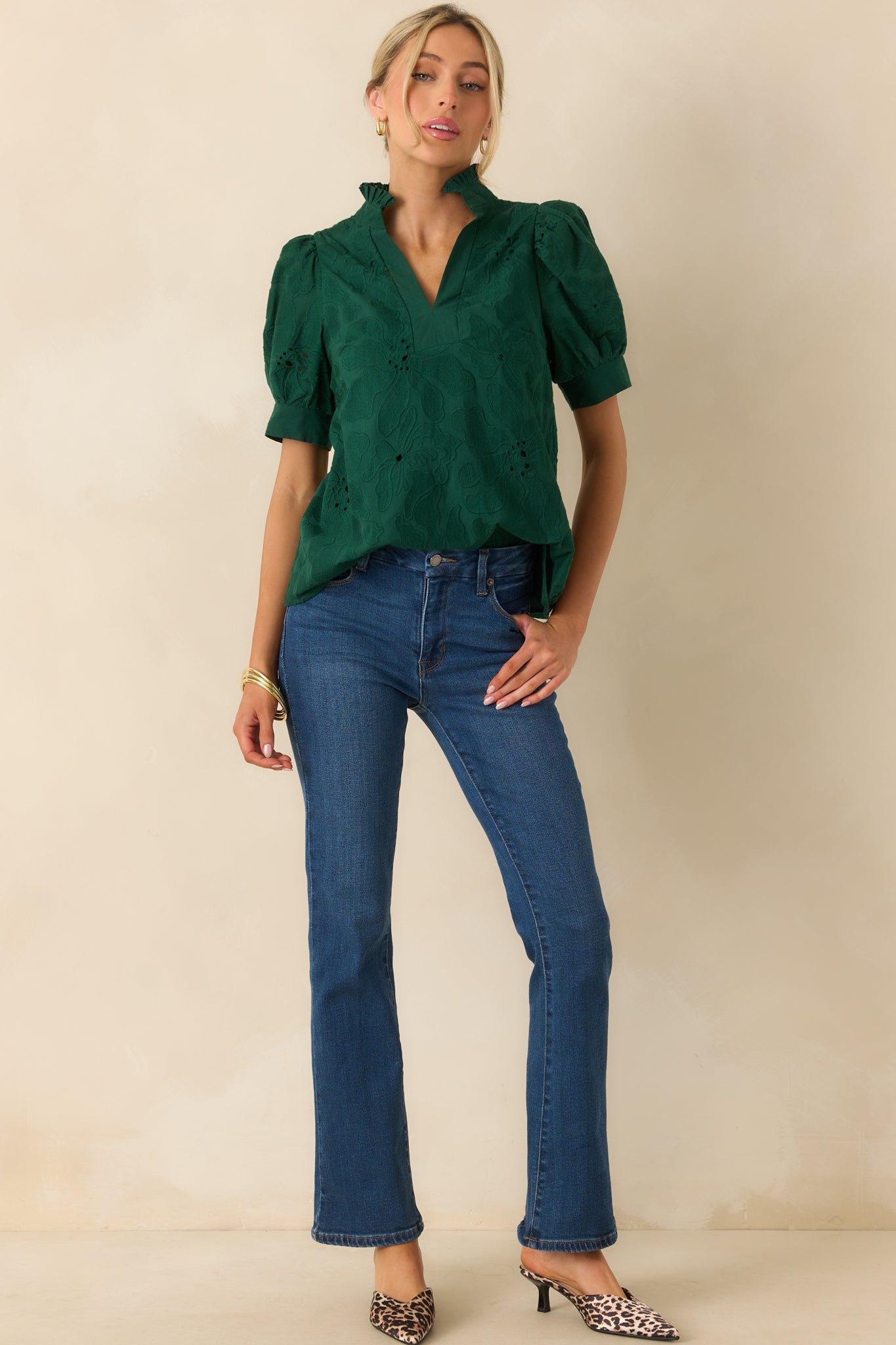Hunter green top with ruffle collar, puff sleeves, and casual, relaxed silhouette.
