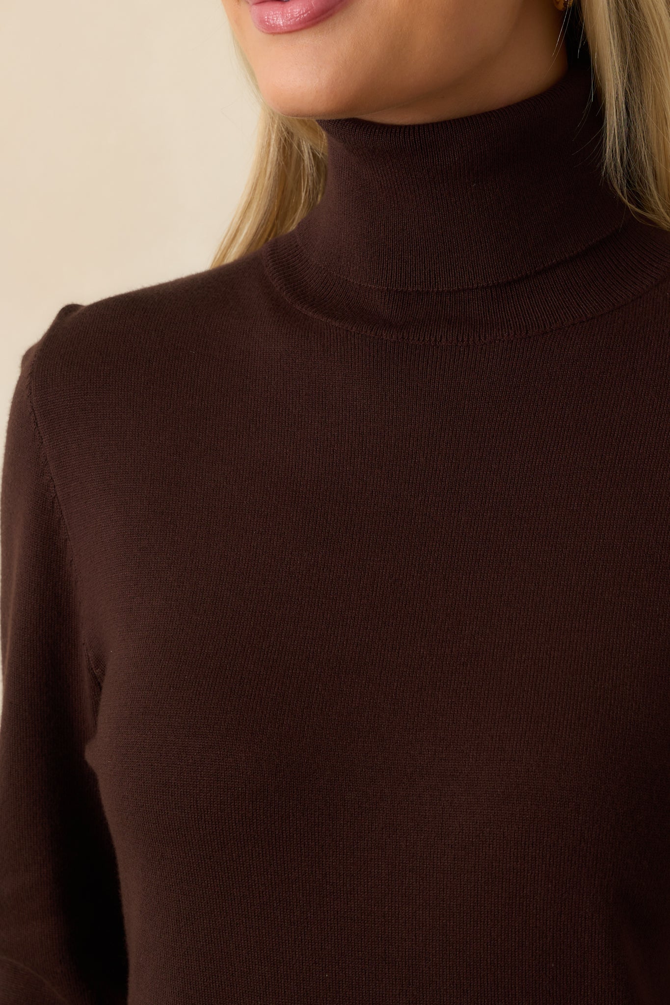 A zoomed-in detail shot of the soft knit fabric and its rich brown hue.