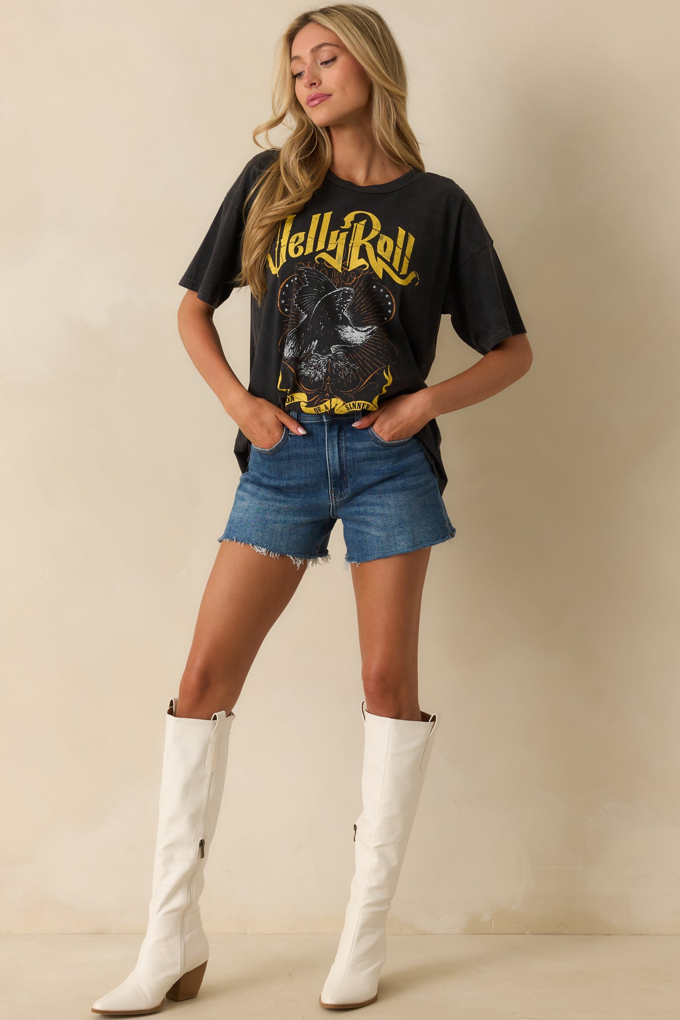 A full front view of the black tee featuring a bold “Son Of A Sinner” inspired graphic across the chest.