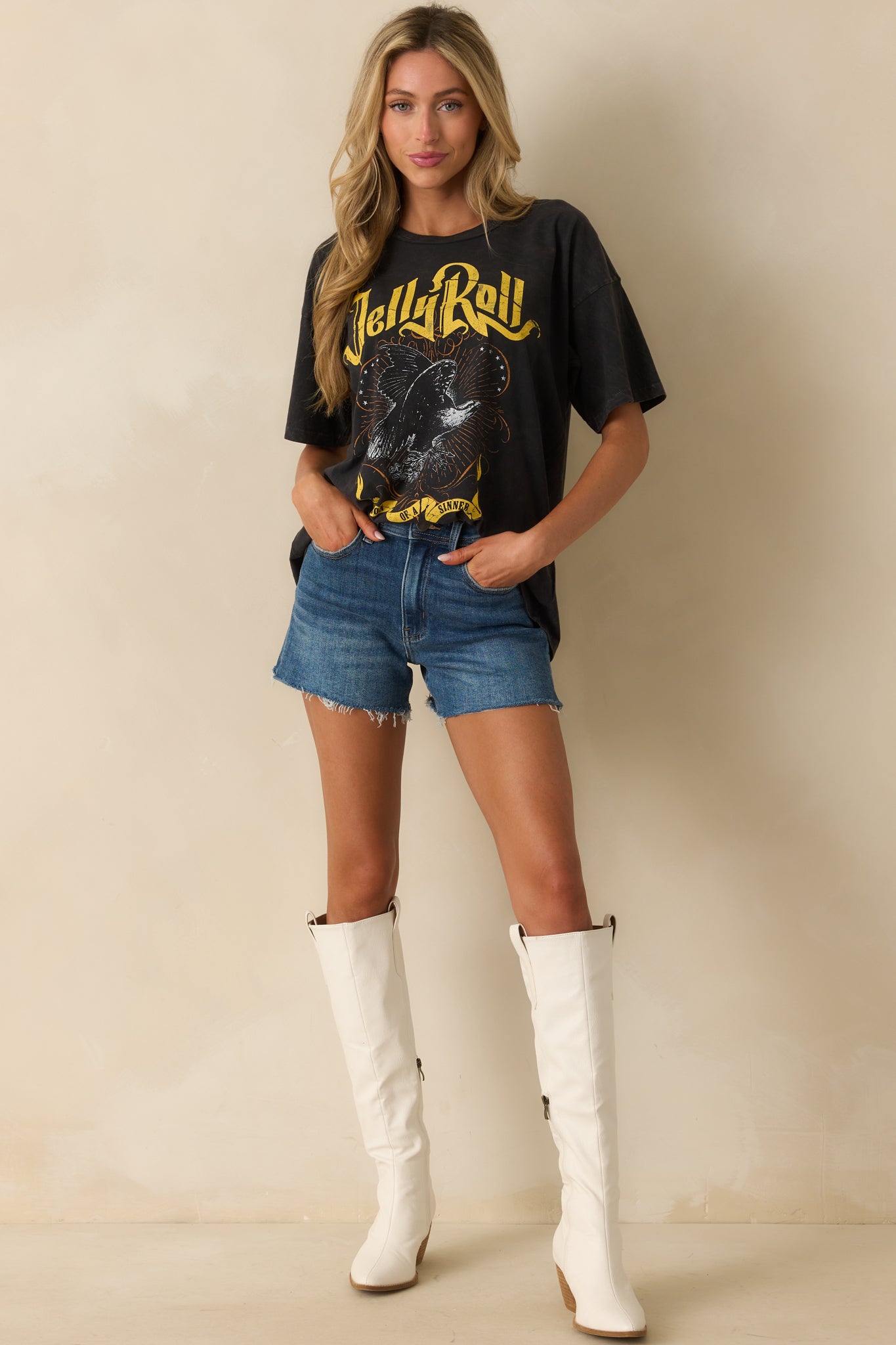 A full body photo highlighting the oversized fit with relaxed short sleeves and crew neckline.