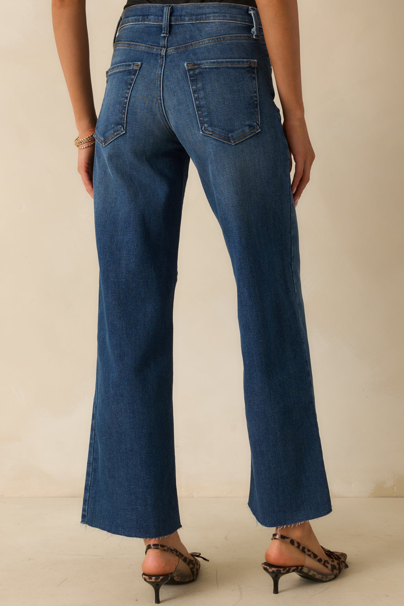 A back view of the jeans showing the two rear pockets and straight leg fit.