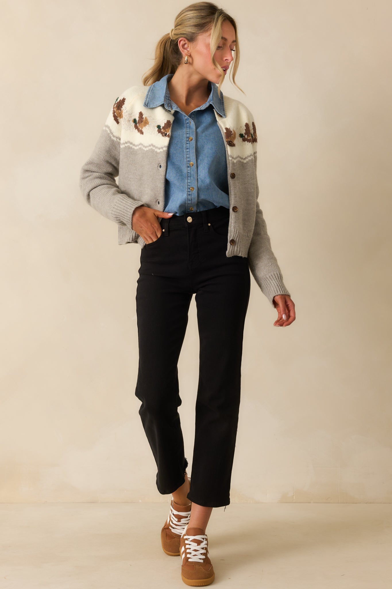 Grey and ivory knit cardigan with a crew neckline and functional button front.