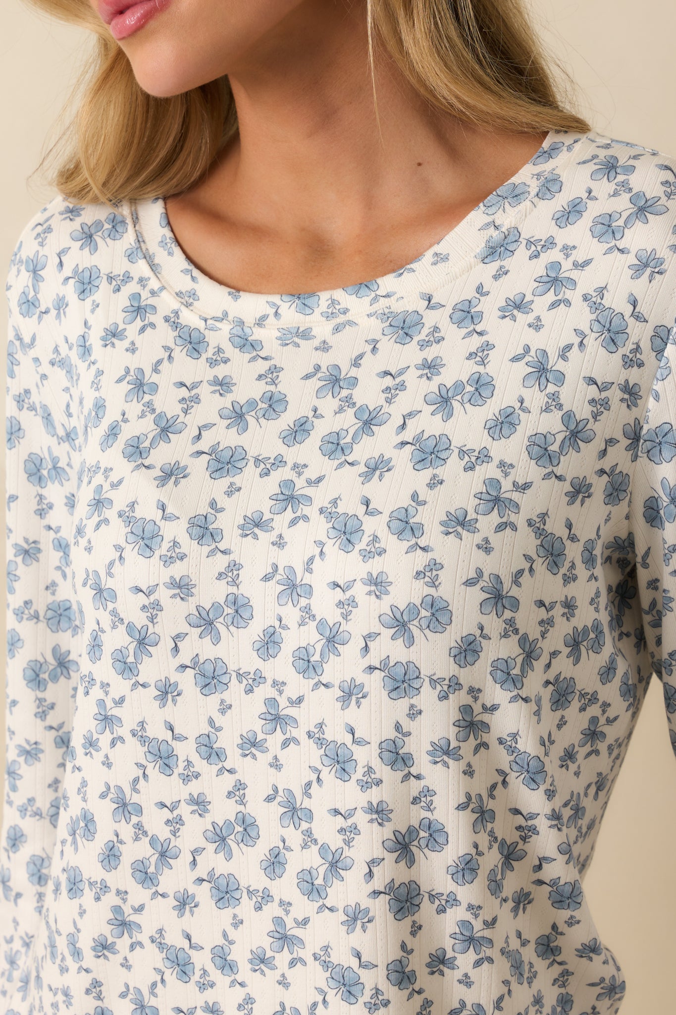 Lettuce-edge hem shown with ribbed knit fabric and floral pattern.