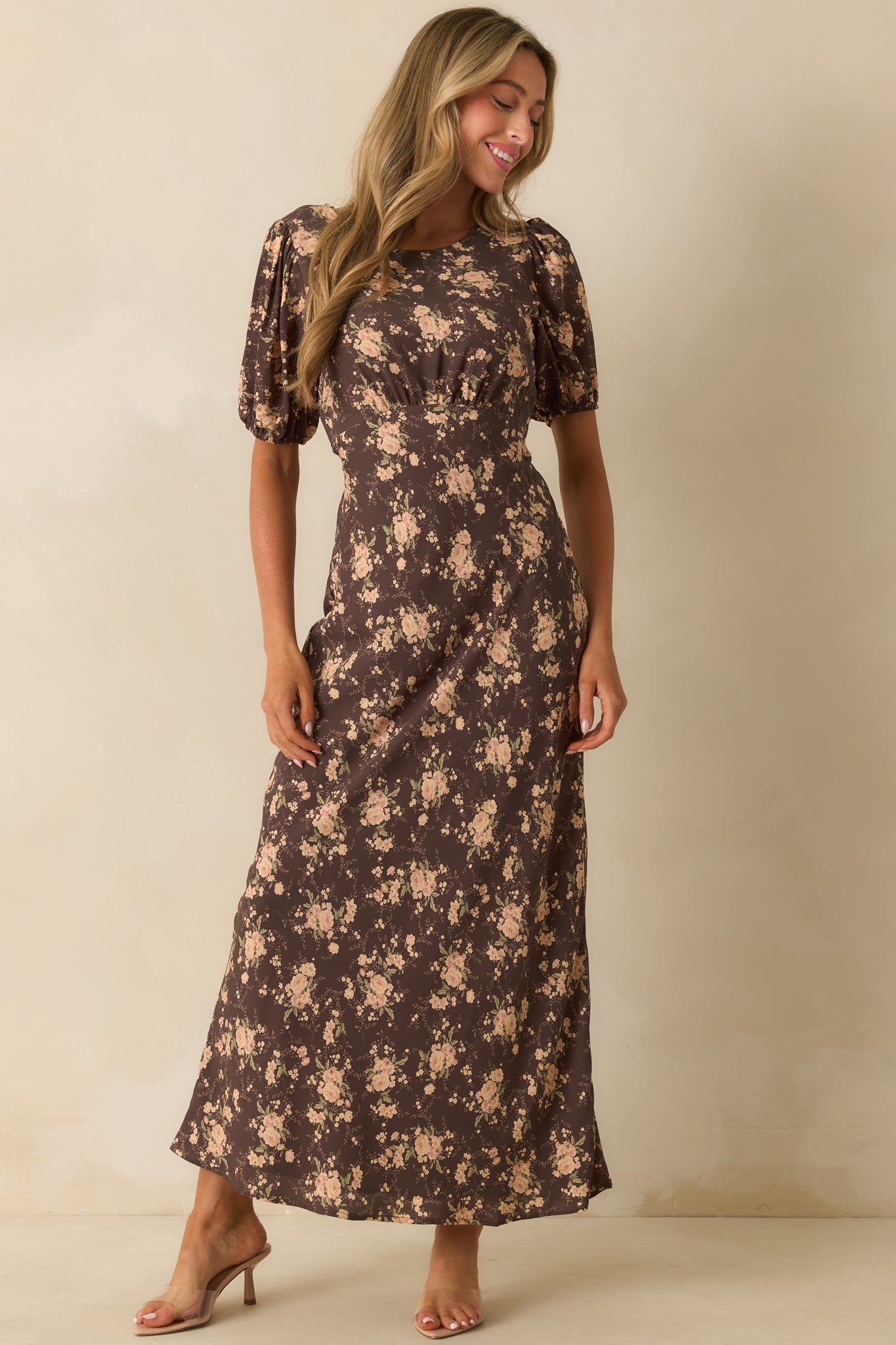 Brown floral dress styled with an adjustable self-tie at the waist.