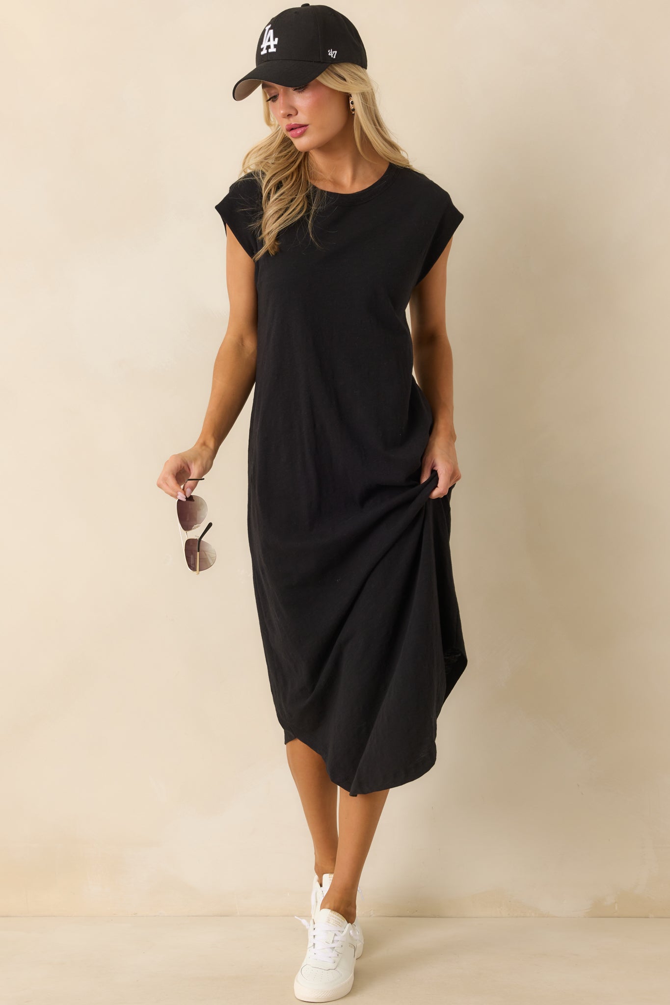 Black midi dress with crew neckline and short cap sleeves shown in a full-length front view.