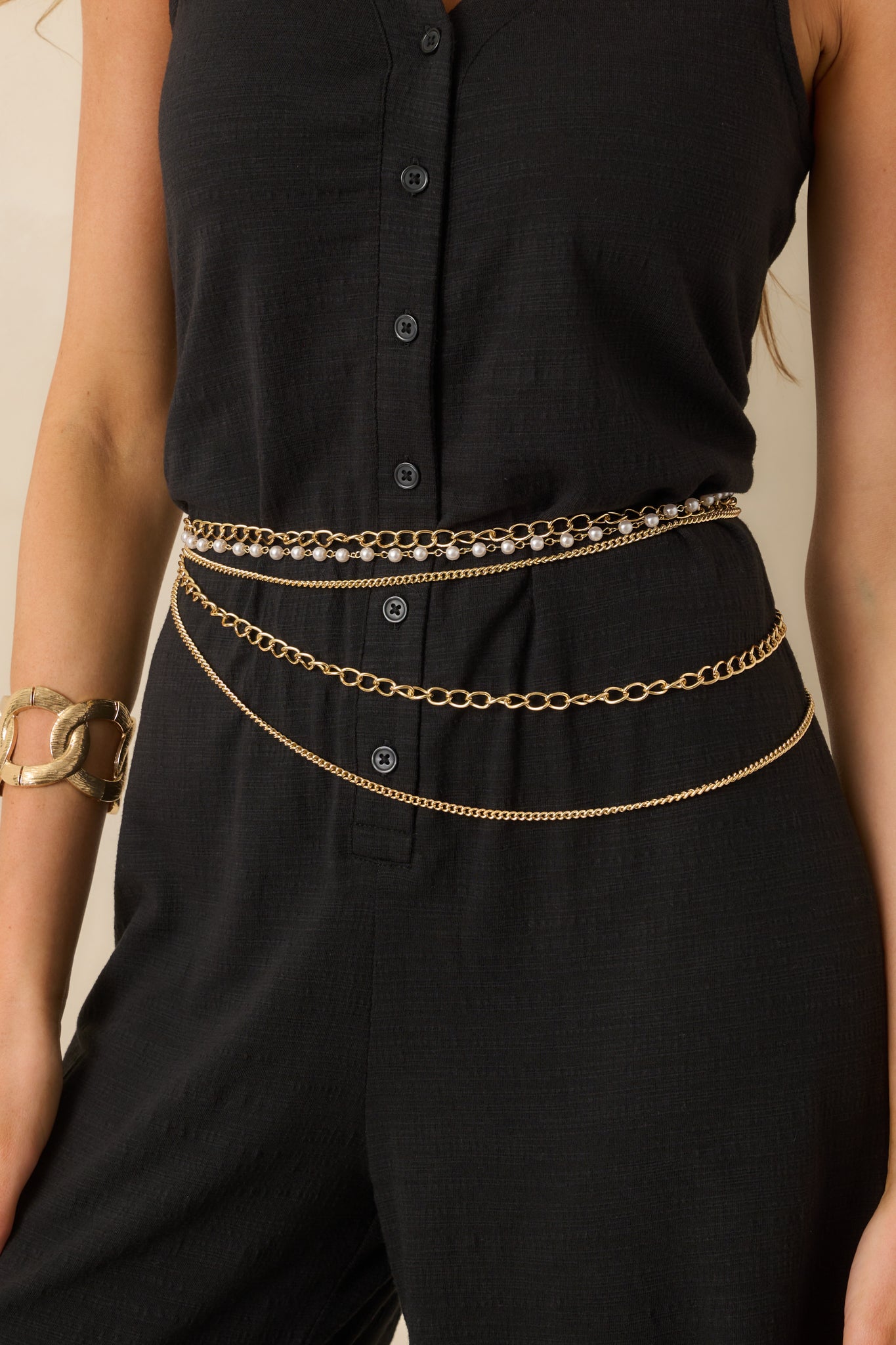 Layered gold chain belt with two rows of medium gold chains and a row of small faux ivory pearls linked with gold chains.